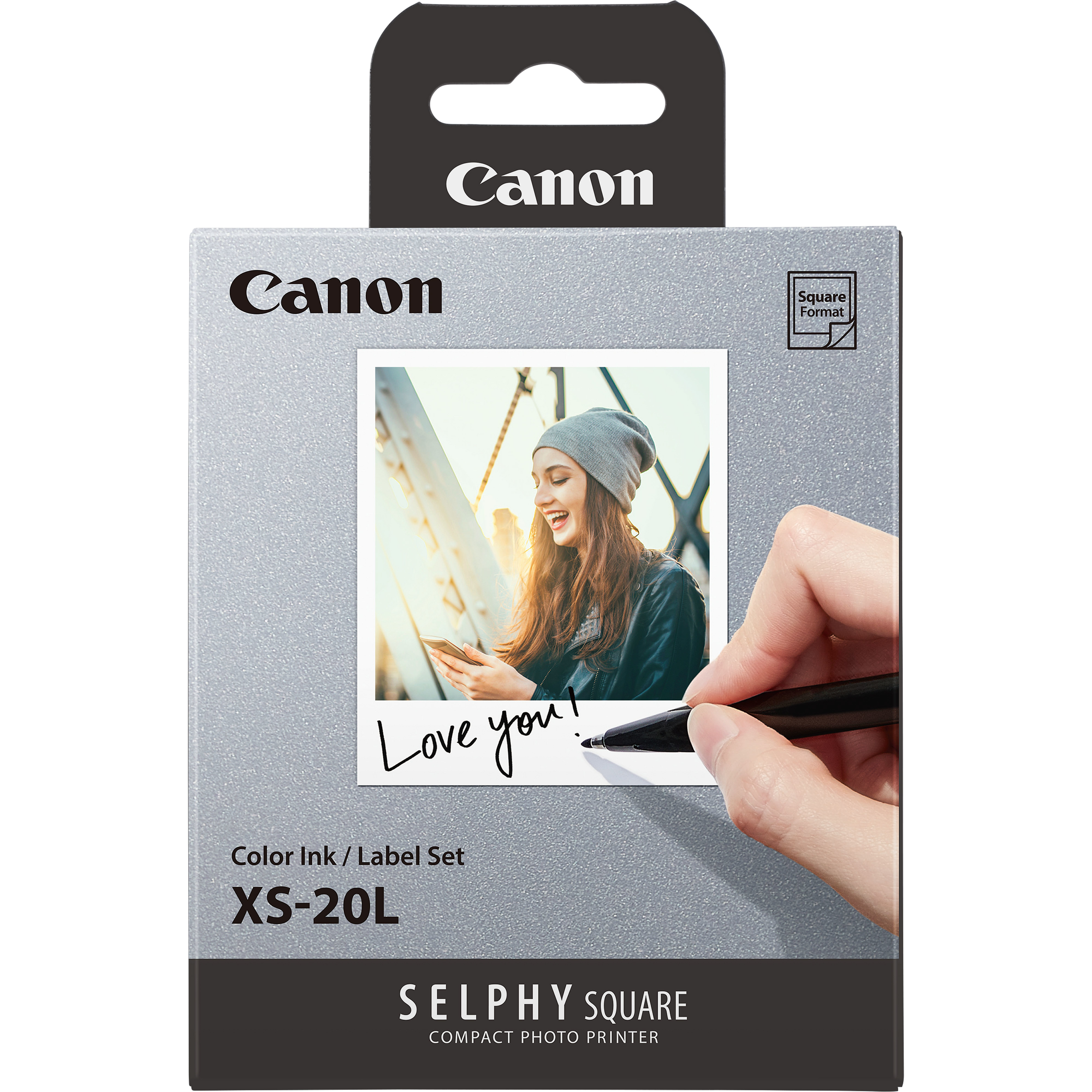 Eine Schachtel mit Canon XS-20L Farb-Tinte/Etiketten-Set mit einem Foto.