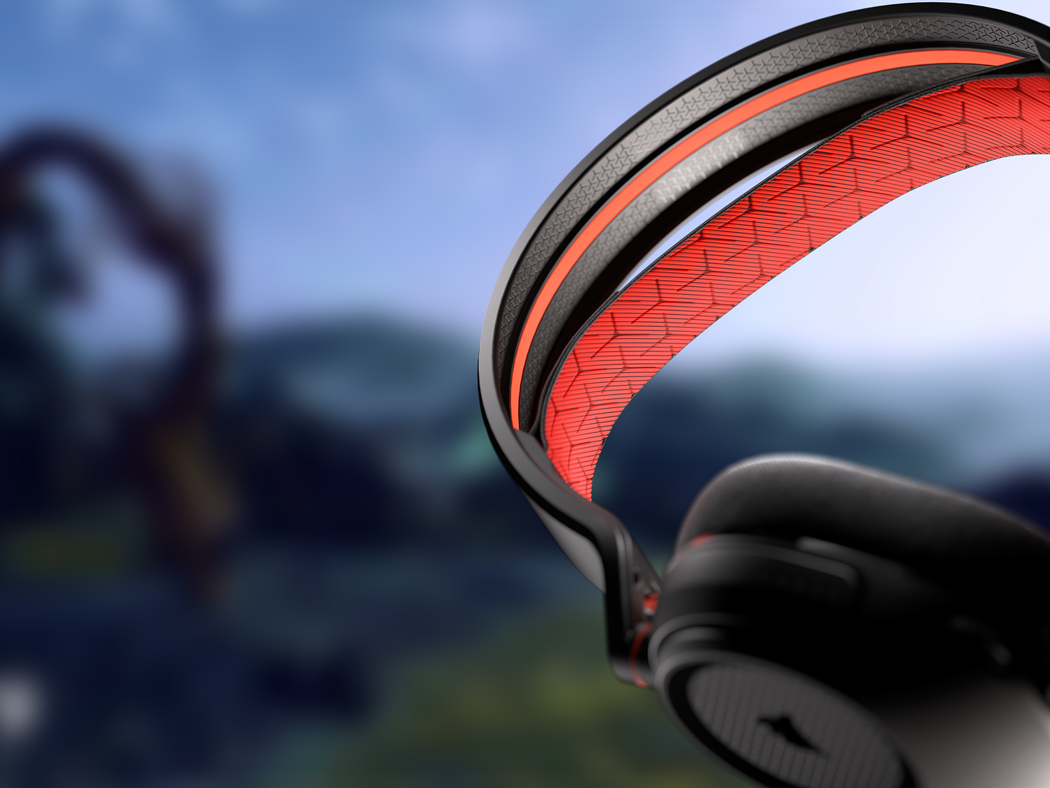 Czarno-czerwone słuchawki. Czerwony wzór siatki na pałąku. Rozmyte tło.