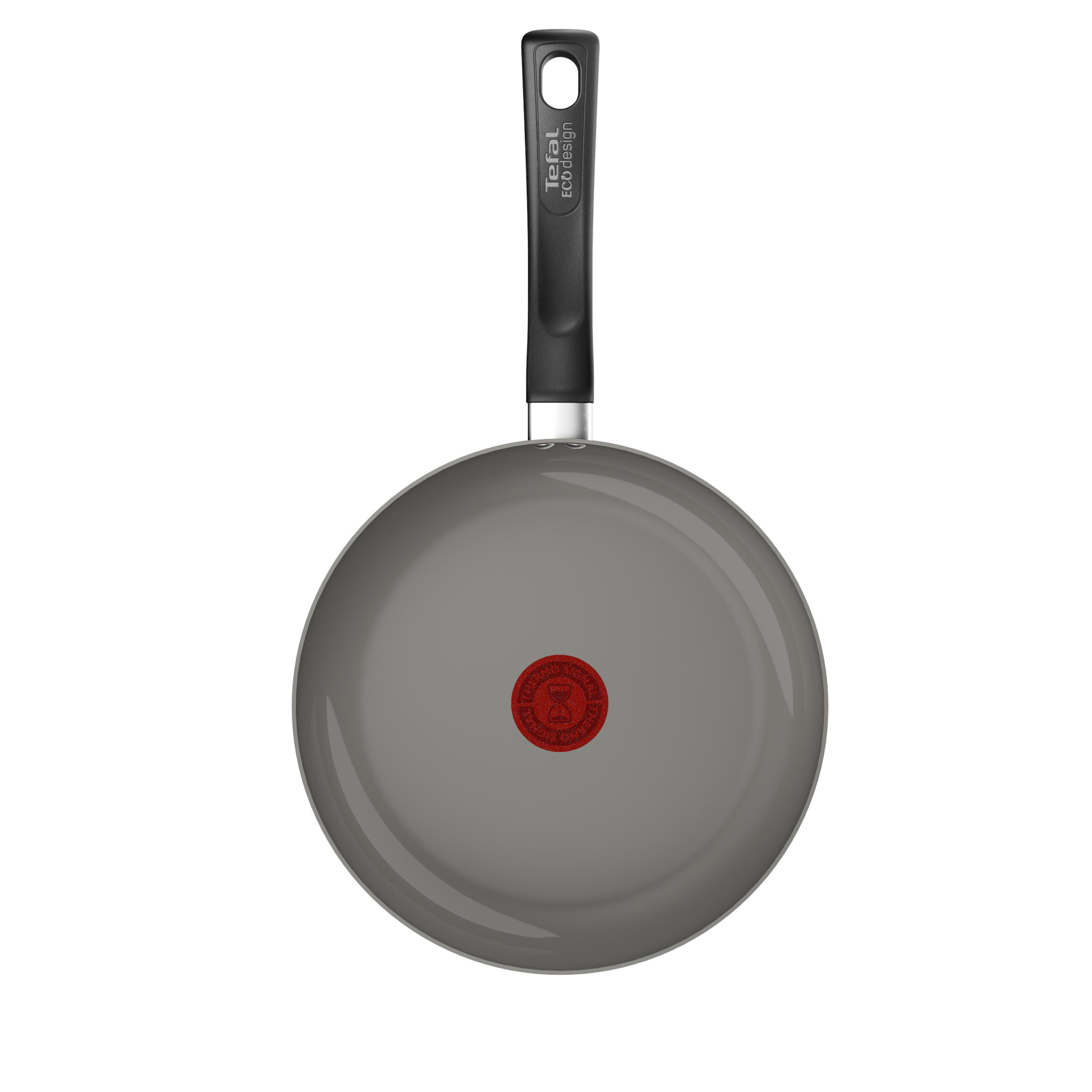 Eine graue Bratpfanne mit schwarzem Griff, von unten, mit dem roten Tefal-Logo in der Mitte.