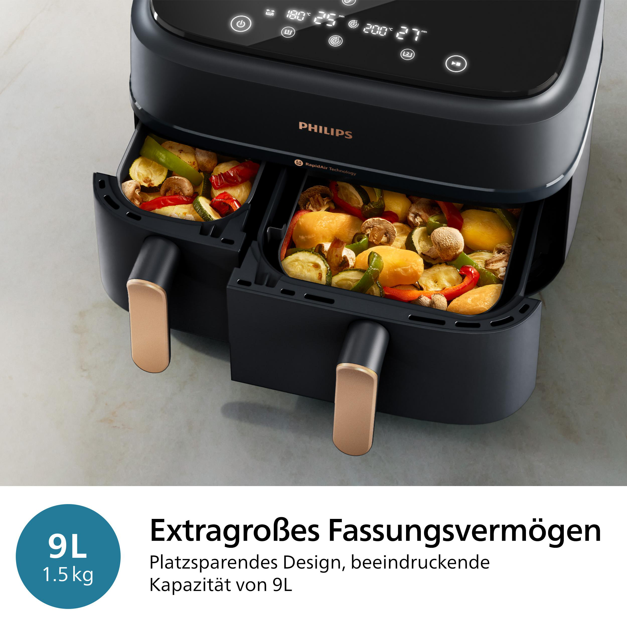 Eine Heißluftfritteuse mit zwei Fächern, die jeweils mit Gemüse gefüllt sind.