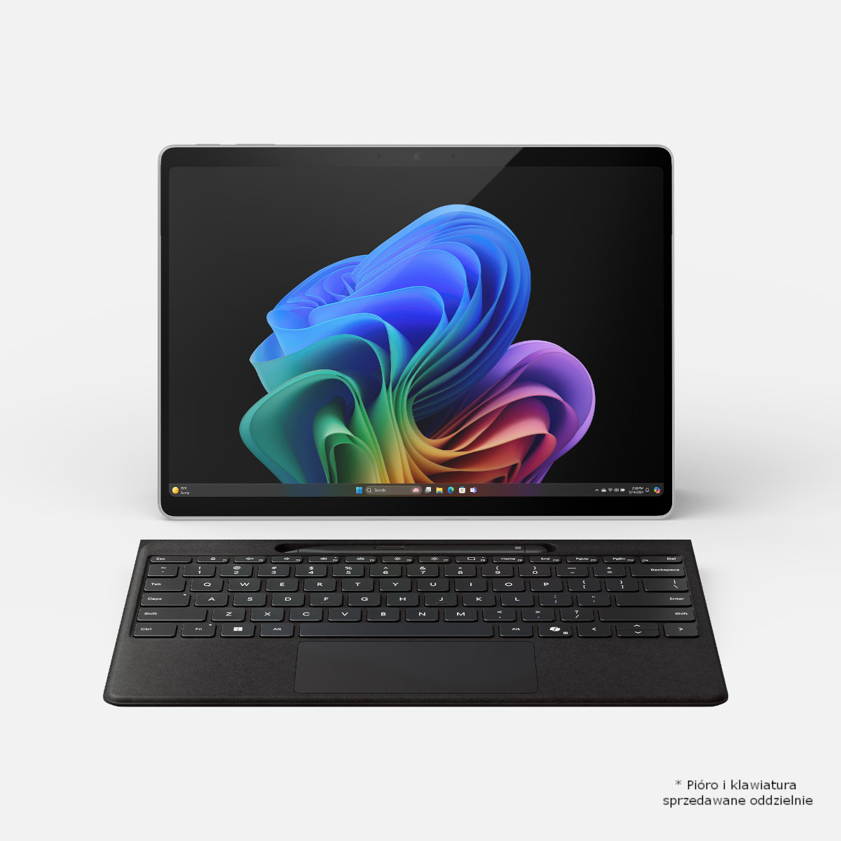 Czarny tablet z klawiaturą. Ekran wyświetla kolorowy, abstrakcyjny obraz.