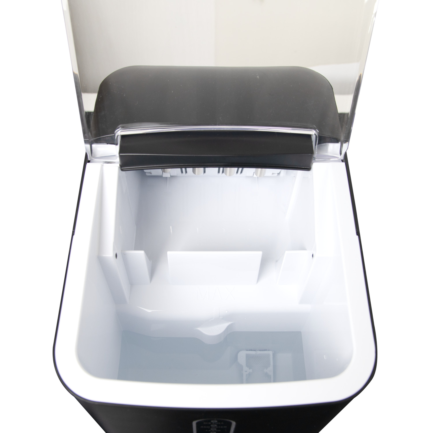 Top view of an ice maker, showing the interior with water and ice tray.