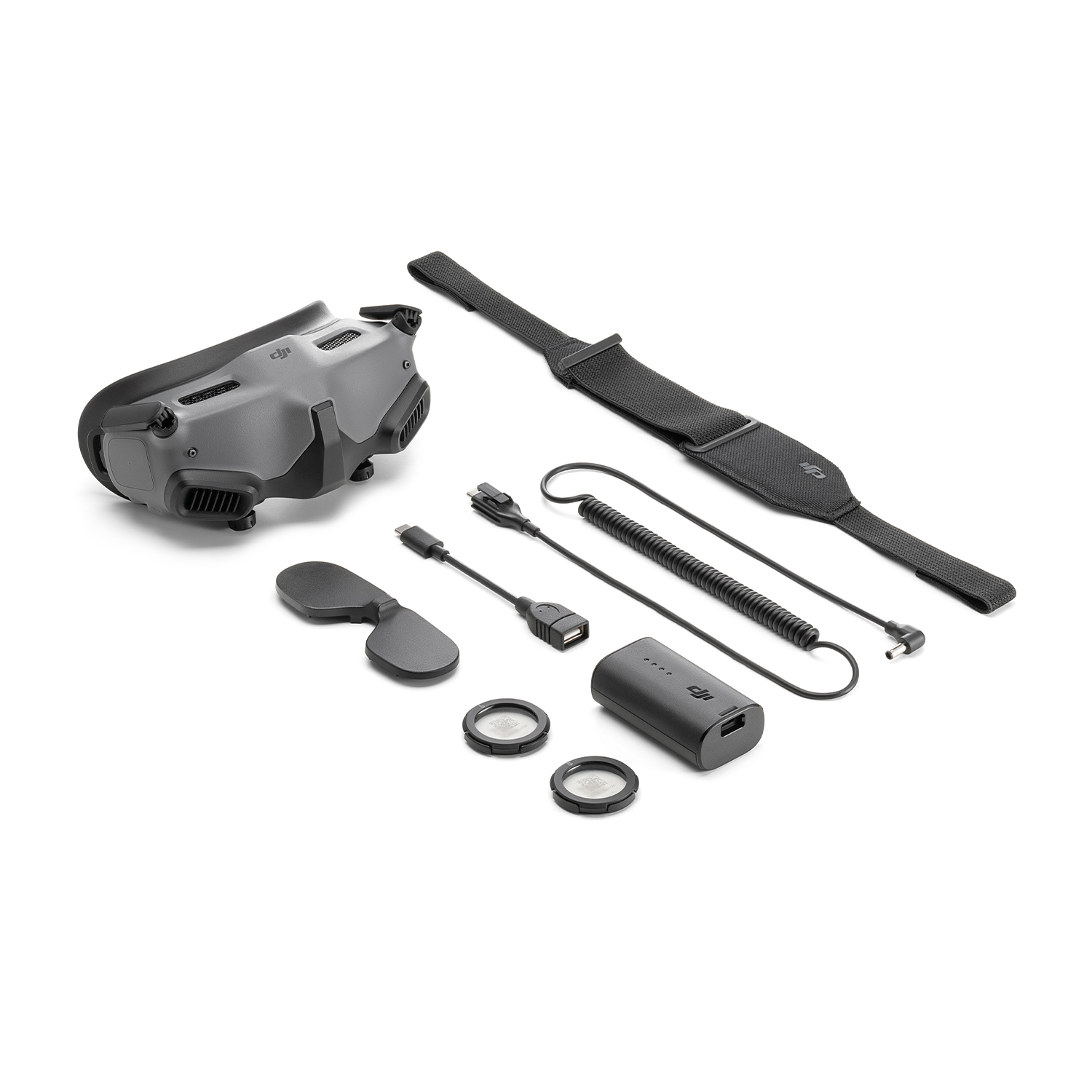 Kit drone DJI FPV. Include occhiali, cinturino, cavi, batteria e accessori.