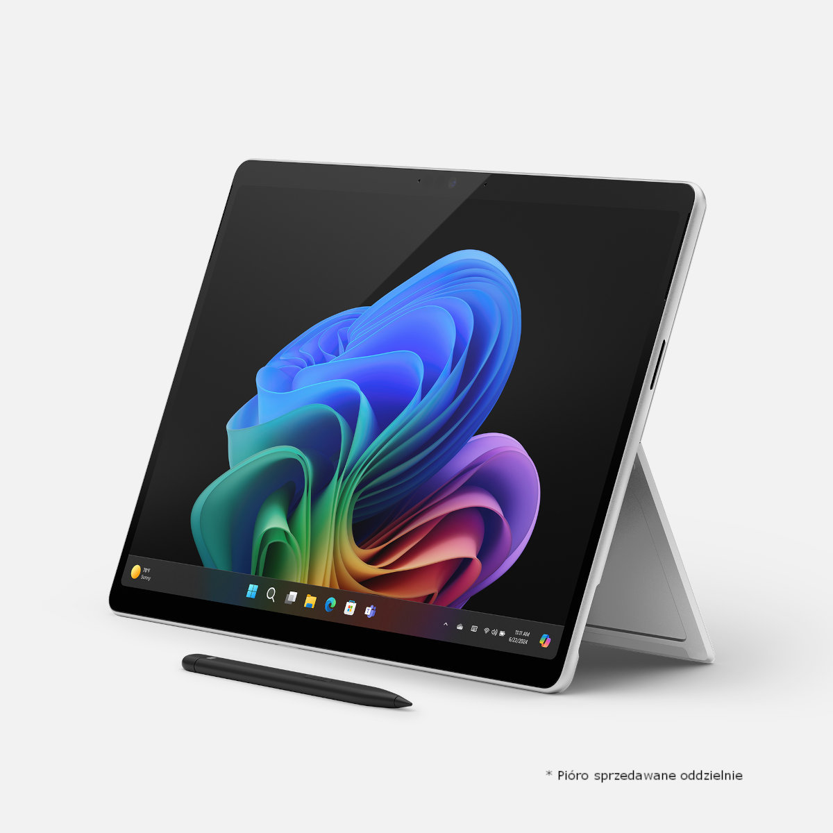 Biały tablet z rysikiem i kolorowym abstrakcyjnym obrazem. Czarne tło.
