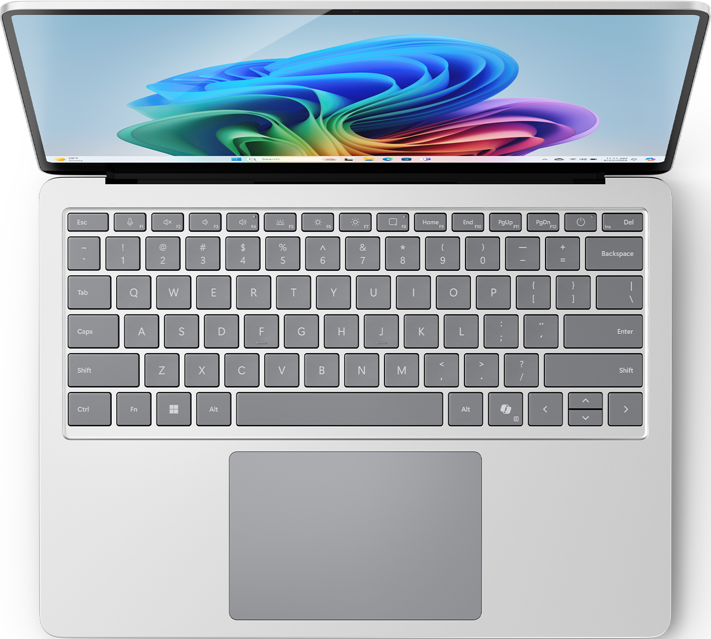 Tastiera del laptop, vista dall'alto. Lo schermo mostra un'immagine astratta colorata. Argento e grigio.