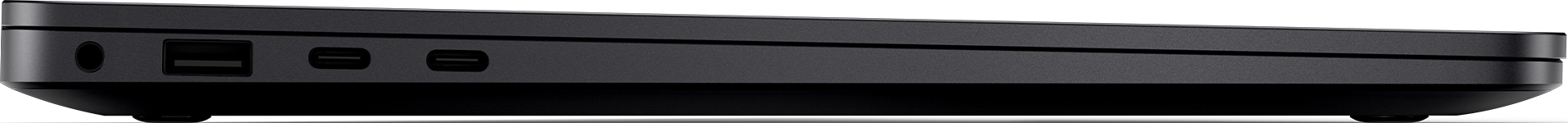 Vista laterale di un laptop nero che mostra porte e dettagli di design.