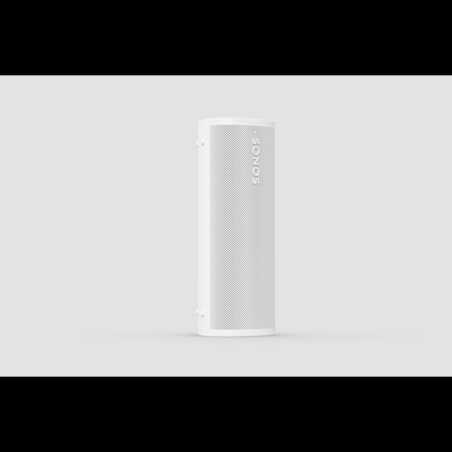 White speaker on white background. Perforated front, simple design.