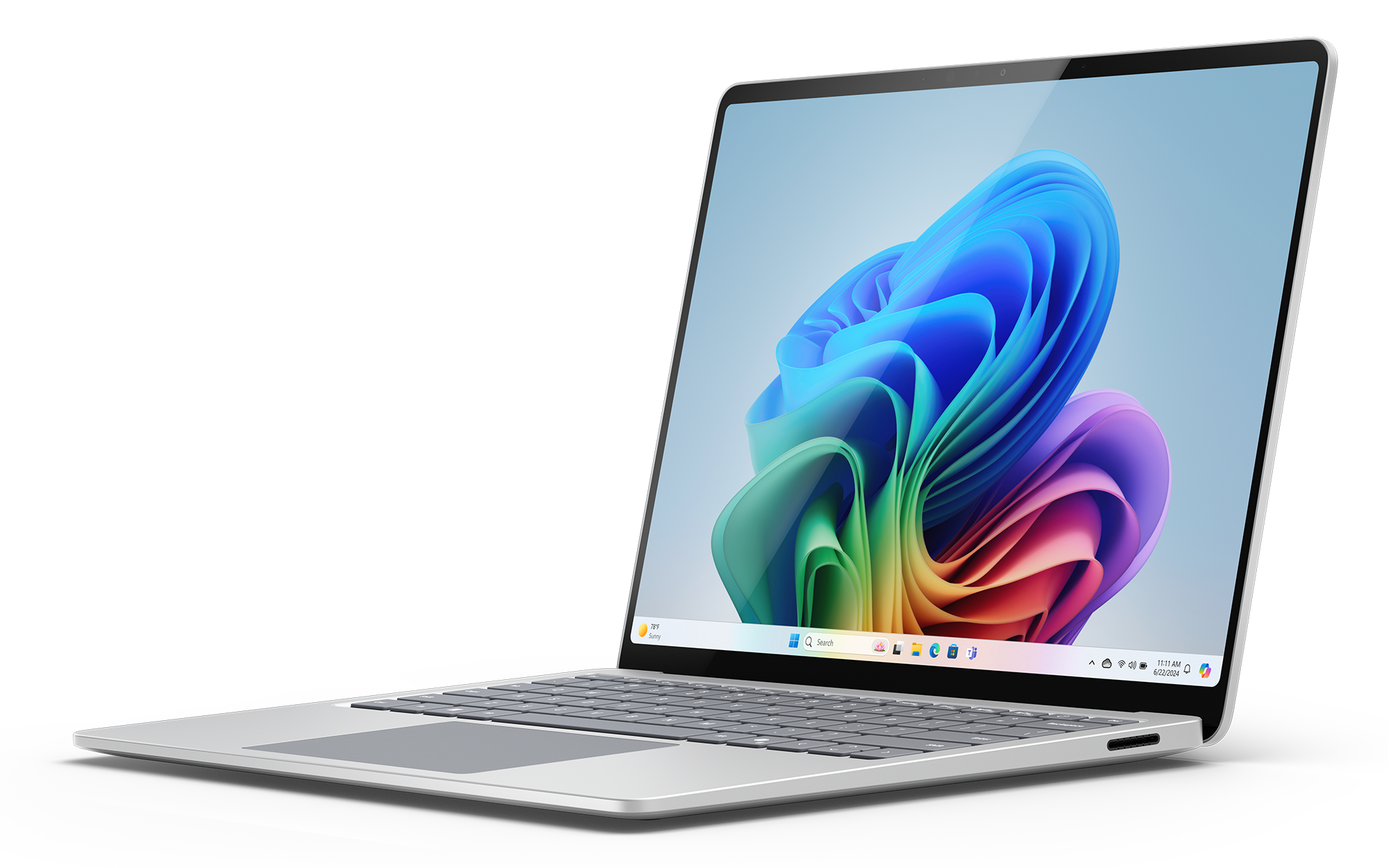 Srebrny laptop z kolorową abstrakcyjną tapetą, czarne tło.