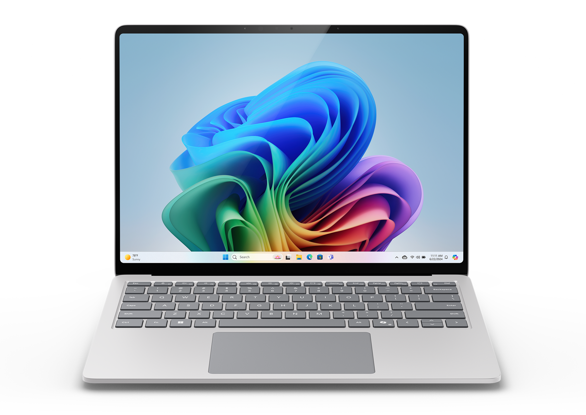 Srebrny laptop z czarnym ekranem, pokazujący kolorowy obraz abstrakcyjny. Tło jest czarne.