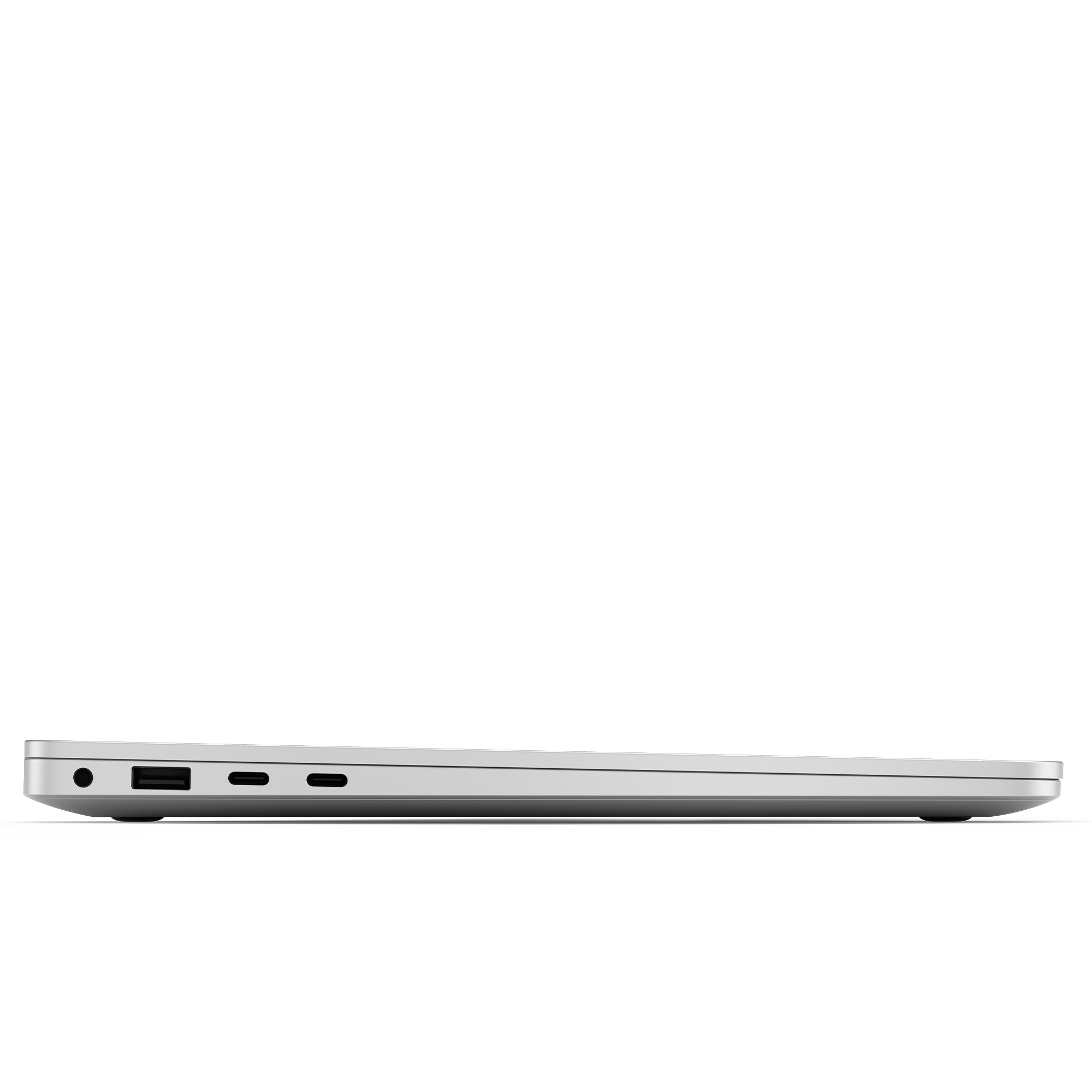 Seitenansicht eines hellgrauen Laptops vor schwarzem Hintergrund. Sichtbare Anschlüsse sind USB und Audio.