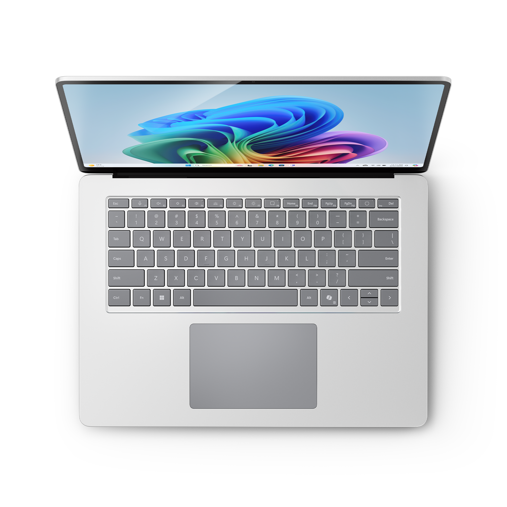 Von oben gesehenes Laptop, geöffnet, mit buntem Bildschirm. Tastatur und Trackpad sichtbar.
