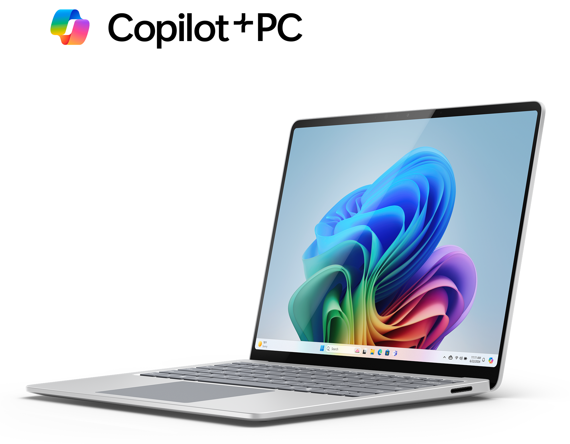 Srebrny laptop z kolorowym, abstrakcyjnym tłem na ekranie, otwarty na biurku.