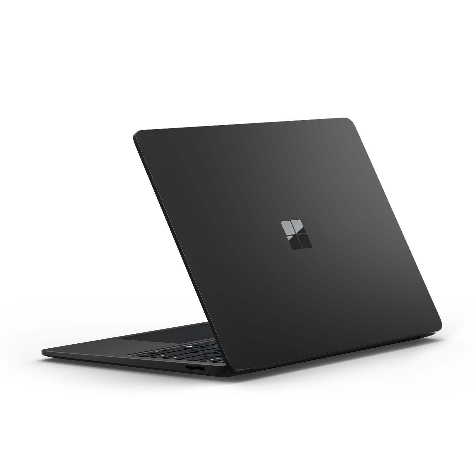 Schwarzer Laptop-Computer von hinten, schräge Ansicht. Der Bildschirm ist geschlossen, zeigt das Microsoft-Logo.