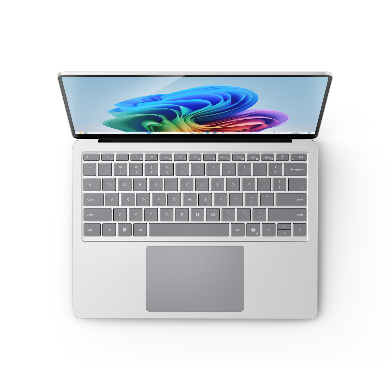 Un ordinateur portable avec un corps blanc, ouvert sur une surface blanche, montrant le clavier et l'écran.