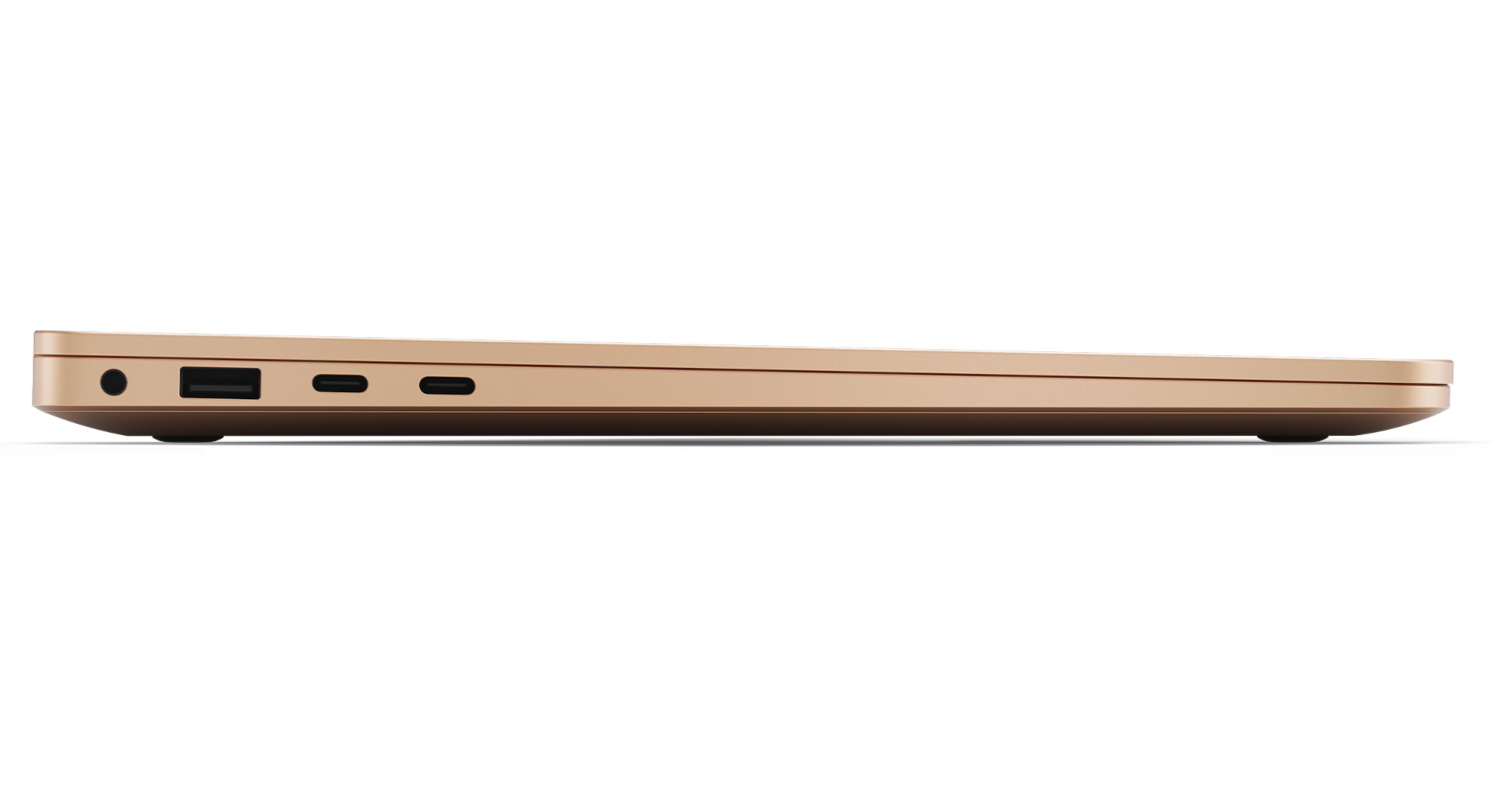 Side view of a gold-colored laptop with ports visible.