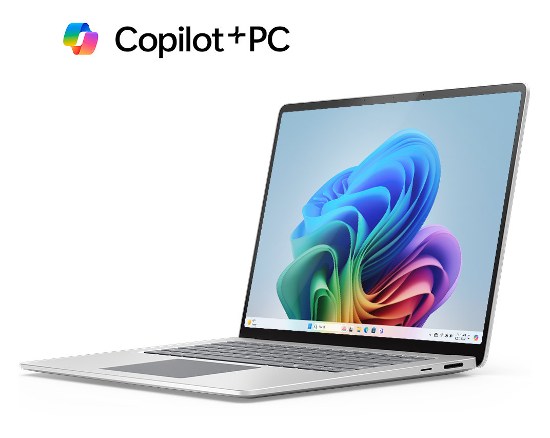 Srebrny laptop z logo 'Copilot+PC', otwarty z kolorowym tłem, białe tło.
