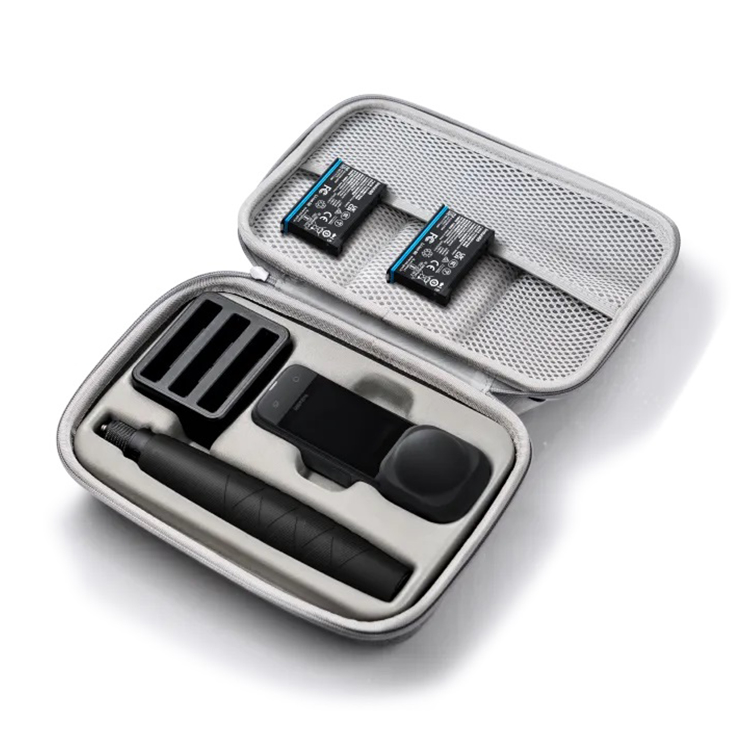 Custodia aperta con base di ricarica, batterie e dispositivo.