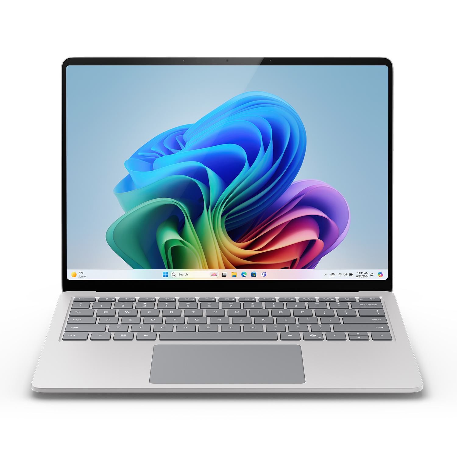 Laptop argento con schermo colorato, aperto, su una superficie bianca.
