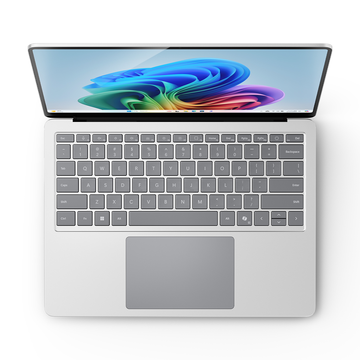 Un laptop argentato, vista dall'alto. Lo schermo mostra un design astratto colorato.