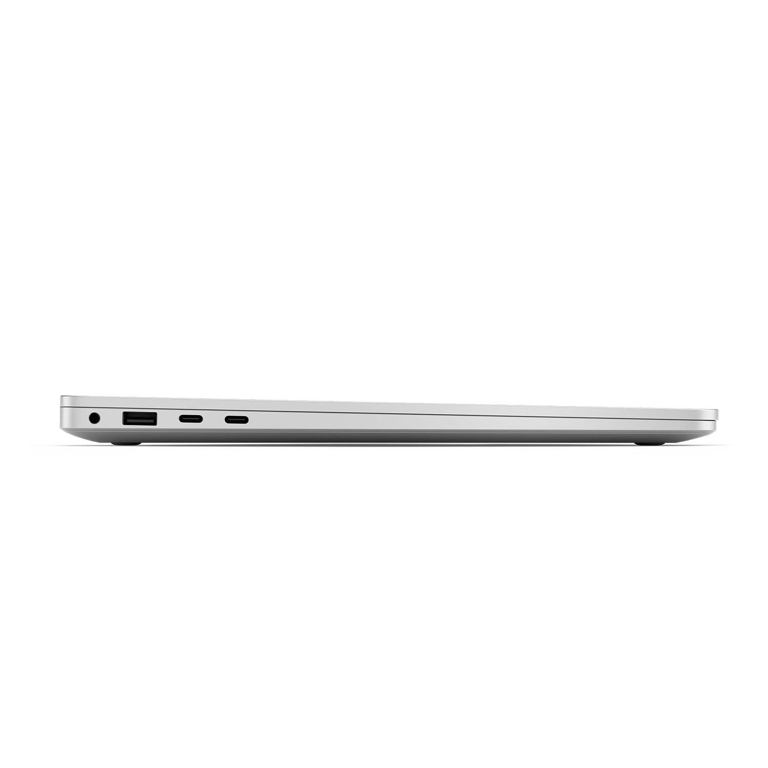 Vista laterale di un laptop argentato. Porte visibili, sfondo bianco.