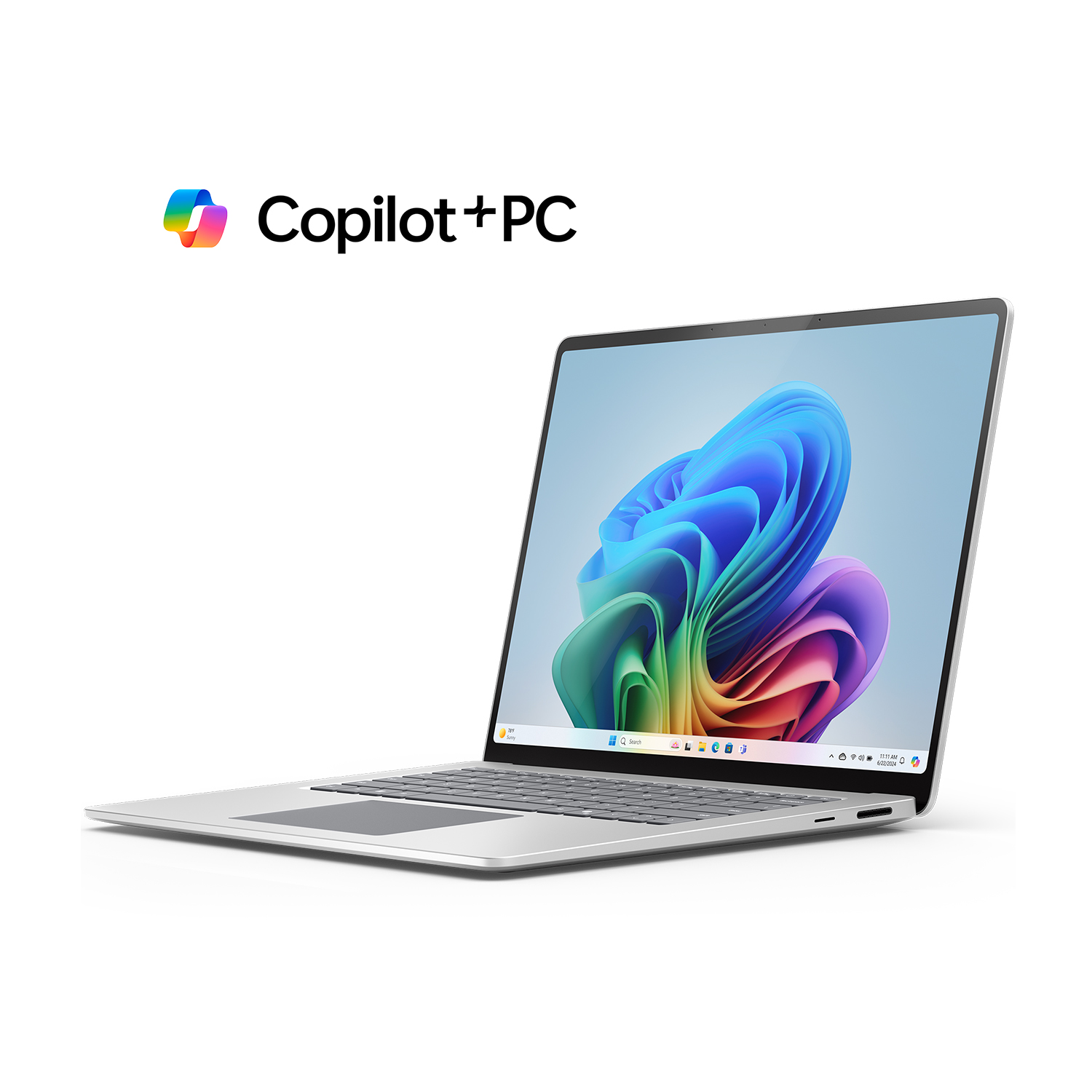 Laptop argentato con logo Copilot+PC, aperto che mostra uno sfondo astratto colorato.