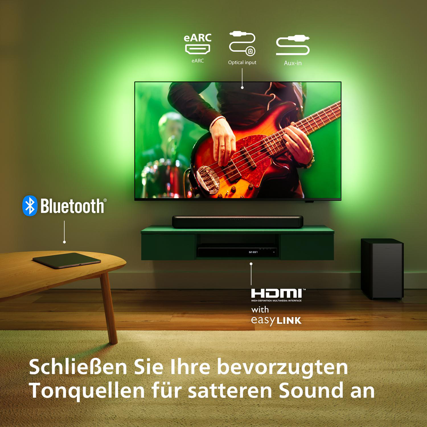 Fernsehbildschirm, der einen Gitarre spielenden Musiker zeigt, mit Soundbar und Subwoofer darunter.