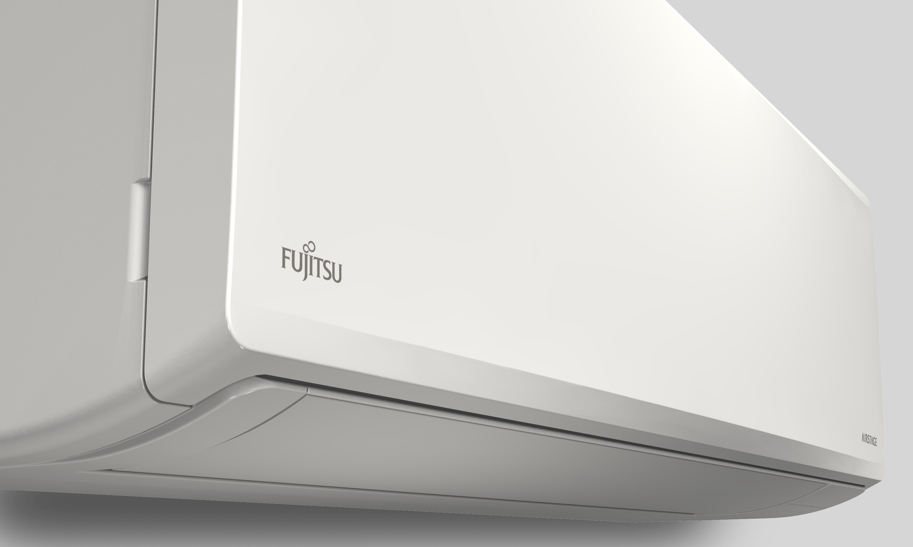 Unidad de aire acondicionado blanca, marca Fujitsu. Sobre fondo blanco.