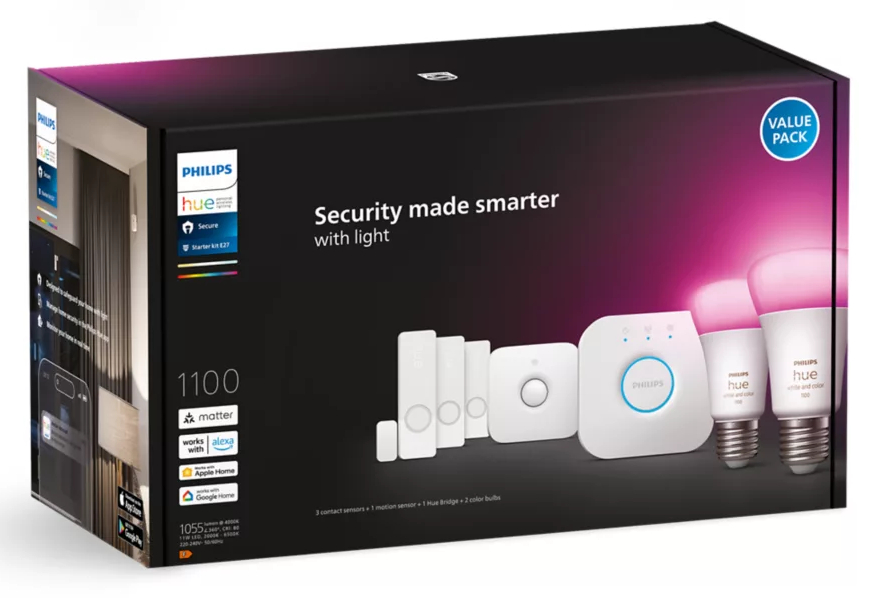 Pudełko systemu bezpieczeństwa smart home Philips Hue, z różnymi urządzeniami i światłami.