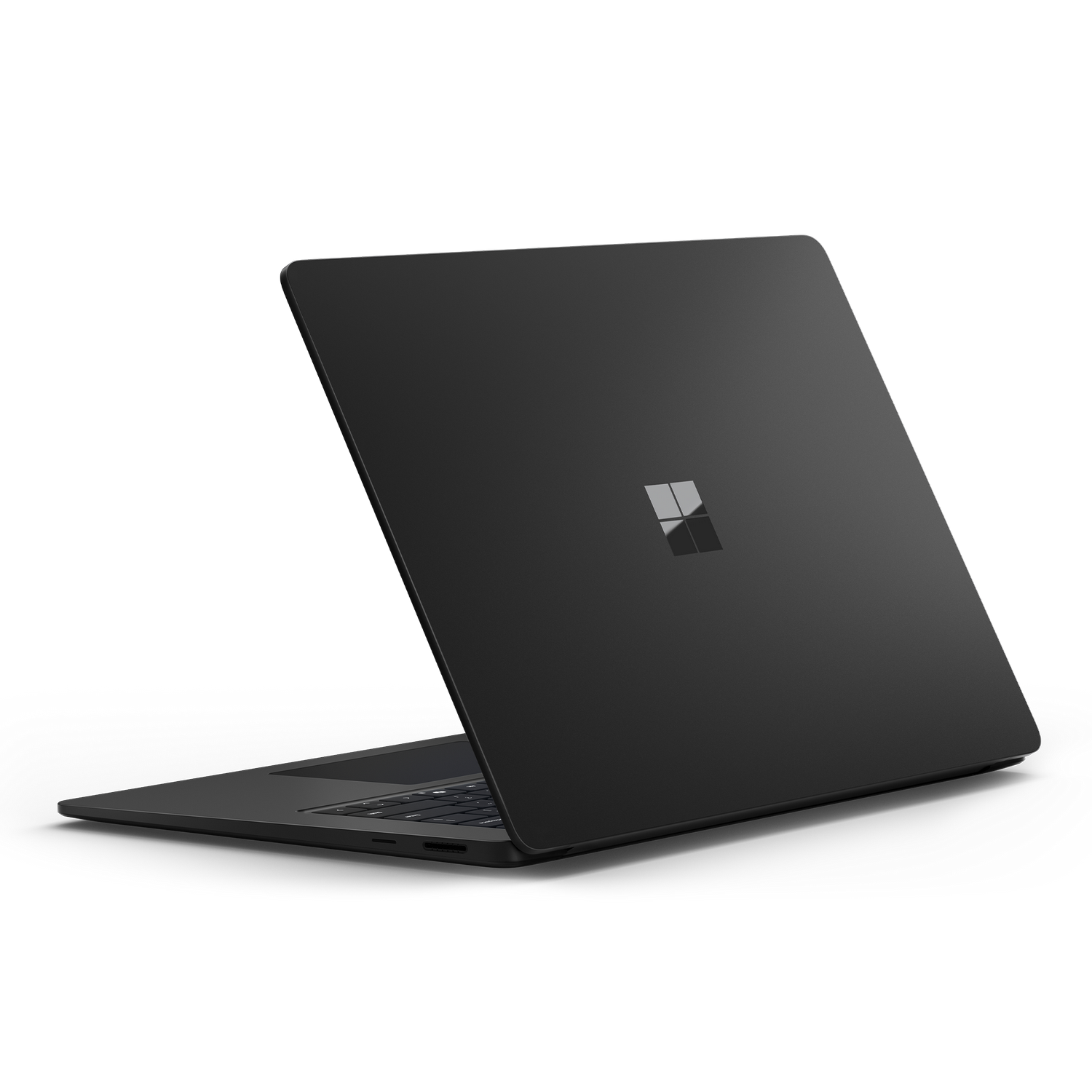 Una computadora portátil negra de Microsoft vista desde atrás, abierta y en ángulo.