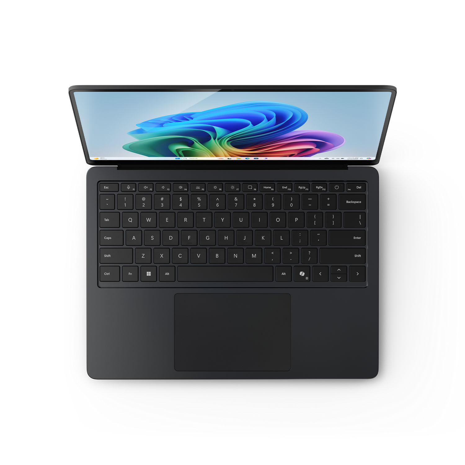 Ordenador portátil con teclado negro, vista superior. Pantalla muestra fondo colorido.