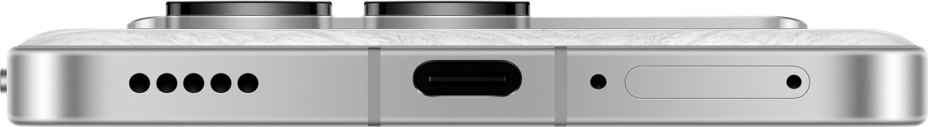 Zbliżenie na dół srebrnego telefonu z portami: USB-C, głośnikami i mikrofonami.