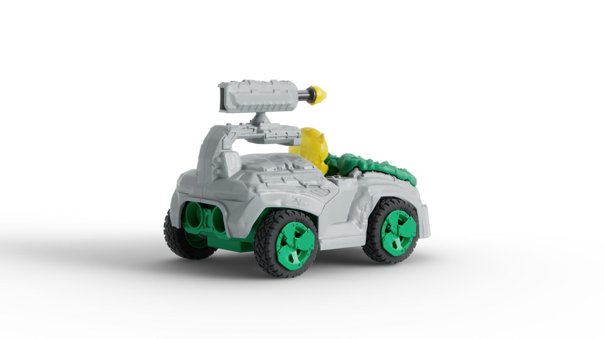 Ein graues Spielzeugauto mit grünen und gelben Akzenten. Es hat eine Kanone und grüne Räder.