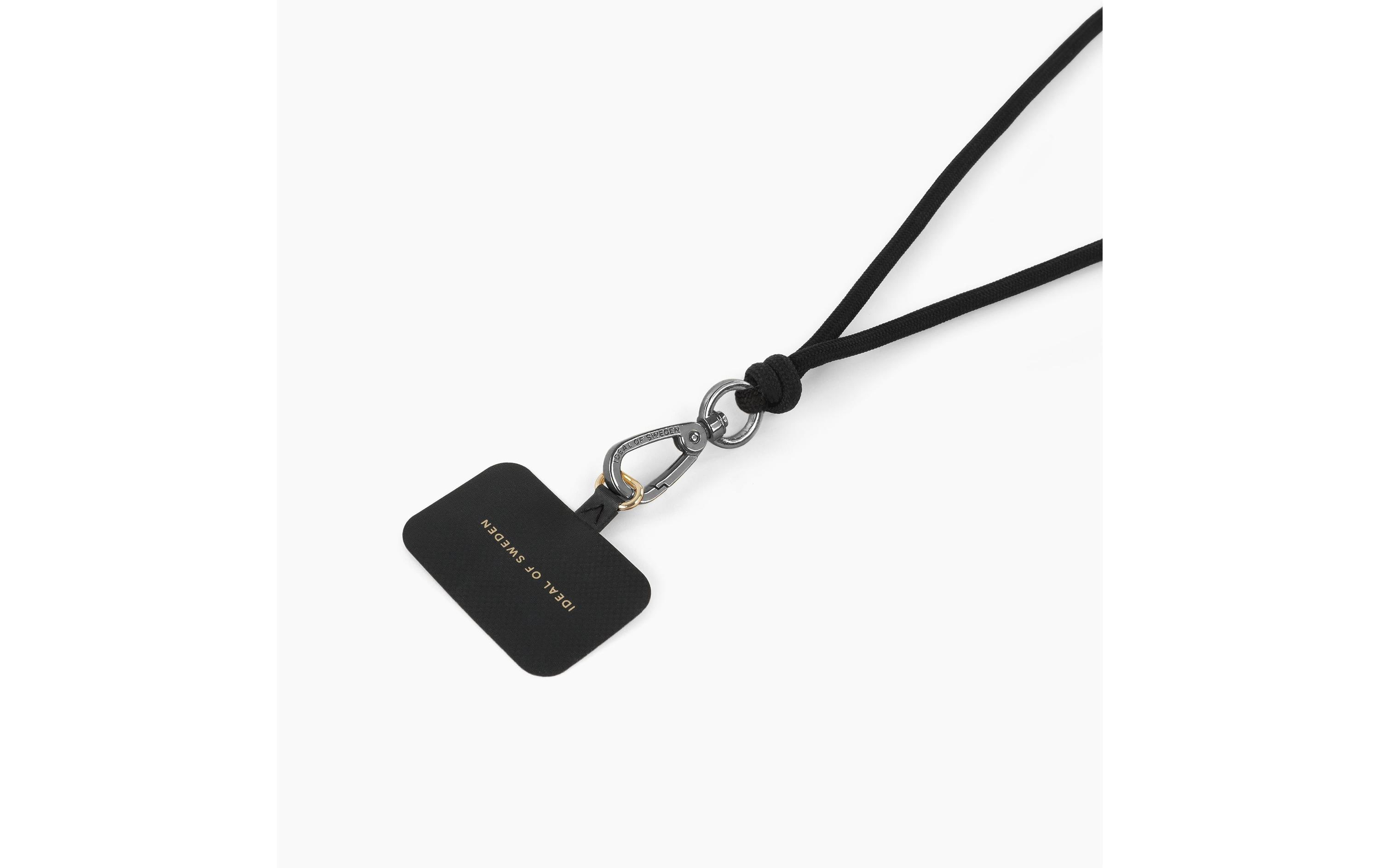 Custodia nera con testo Ideal of Sweden, attaccata a corda nera con moschettone metallico, su sfondo bianco.