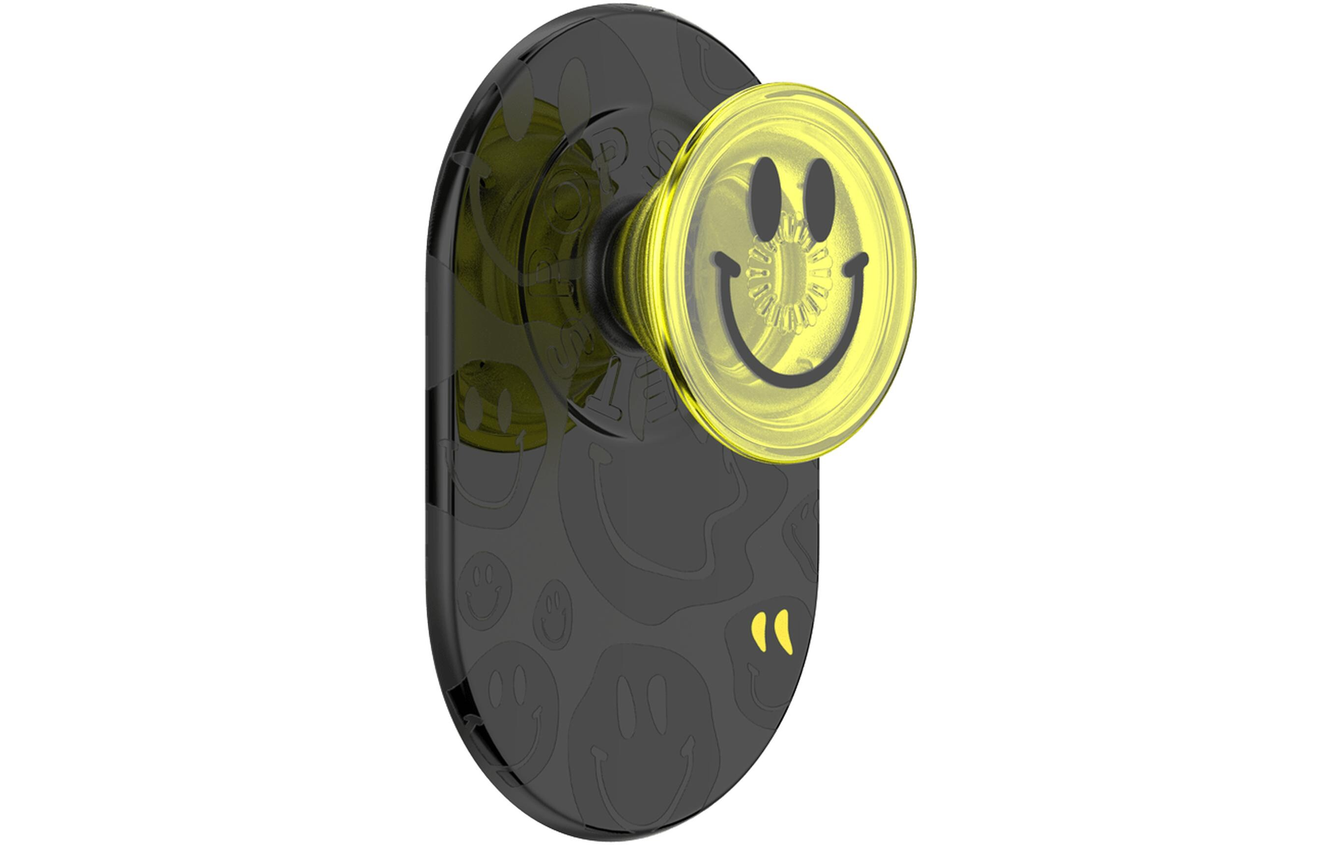 Poignée de téléphone noire avec un visage souriant jaune, montée sur une surface noire.