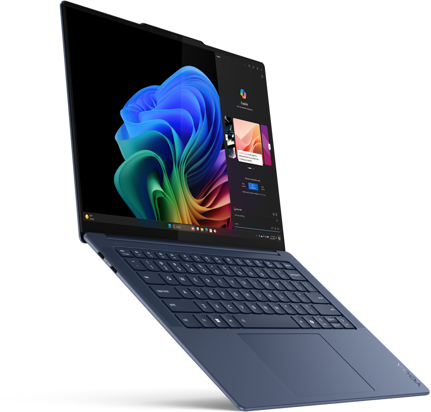 Nyitott laptop, színes grafikával a képernyőn.