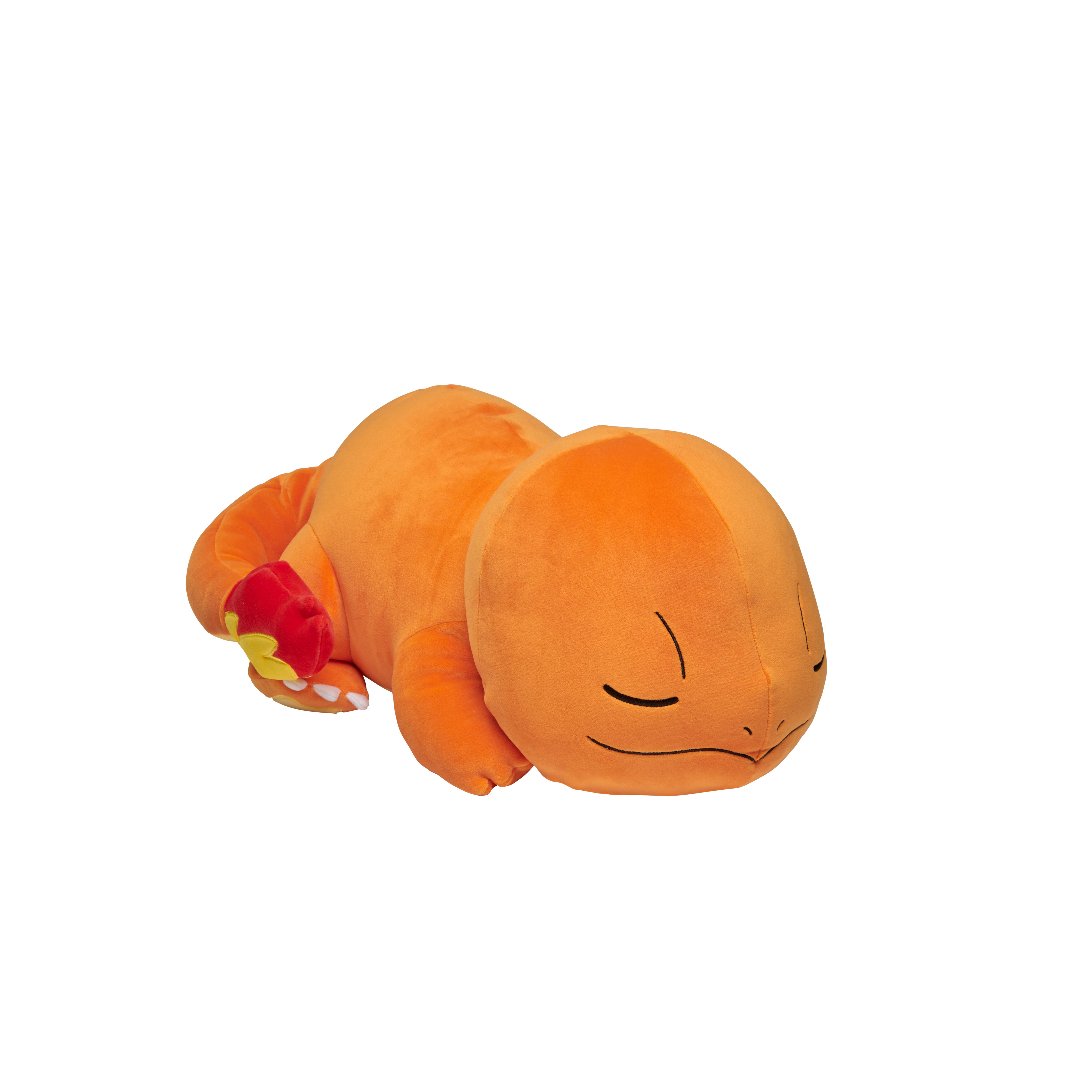 Ein orangefarbenes Charmander-Plüschtier, das auf weißem Hintergrund liegt.