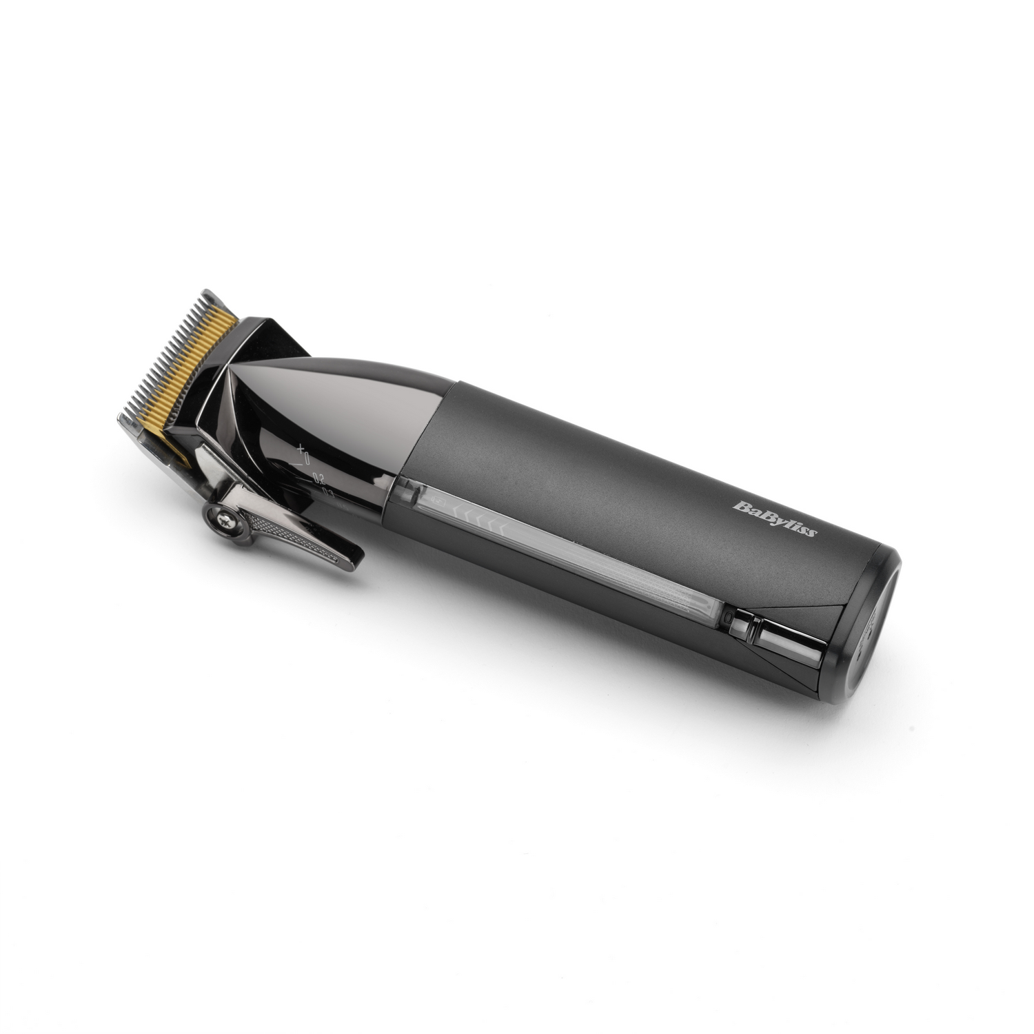 Cortadora de cabello Babyliss negra y gris sobre superficie blanca. Vista en ángulo.