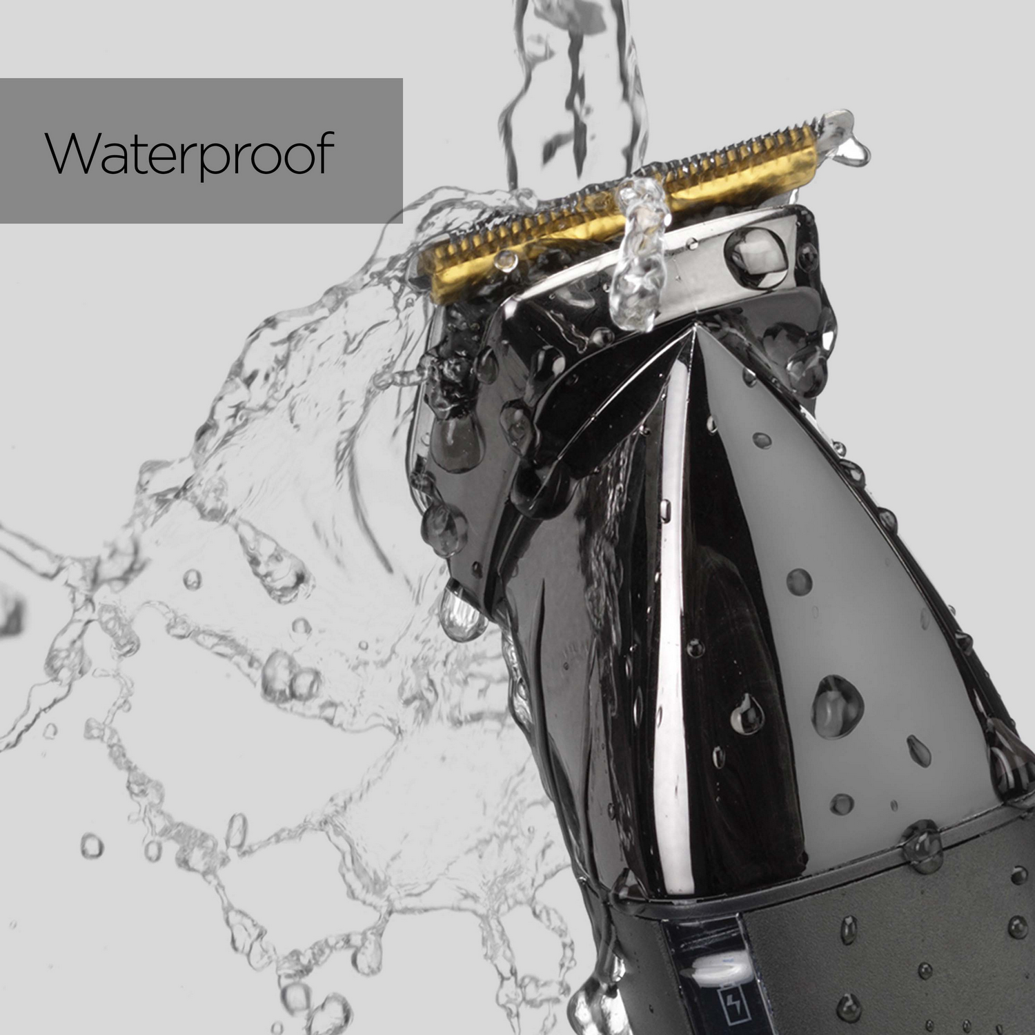 Un cortapelos eléctrico negro con agua salpicando. Texto: Impermeable.