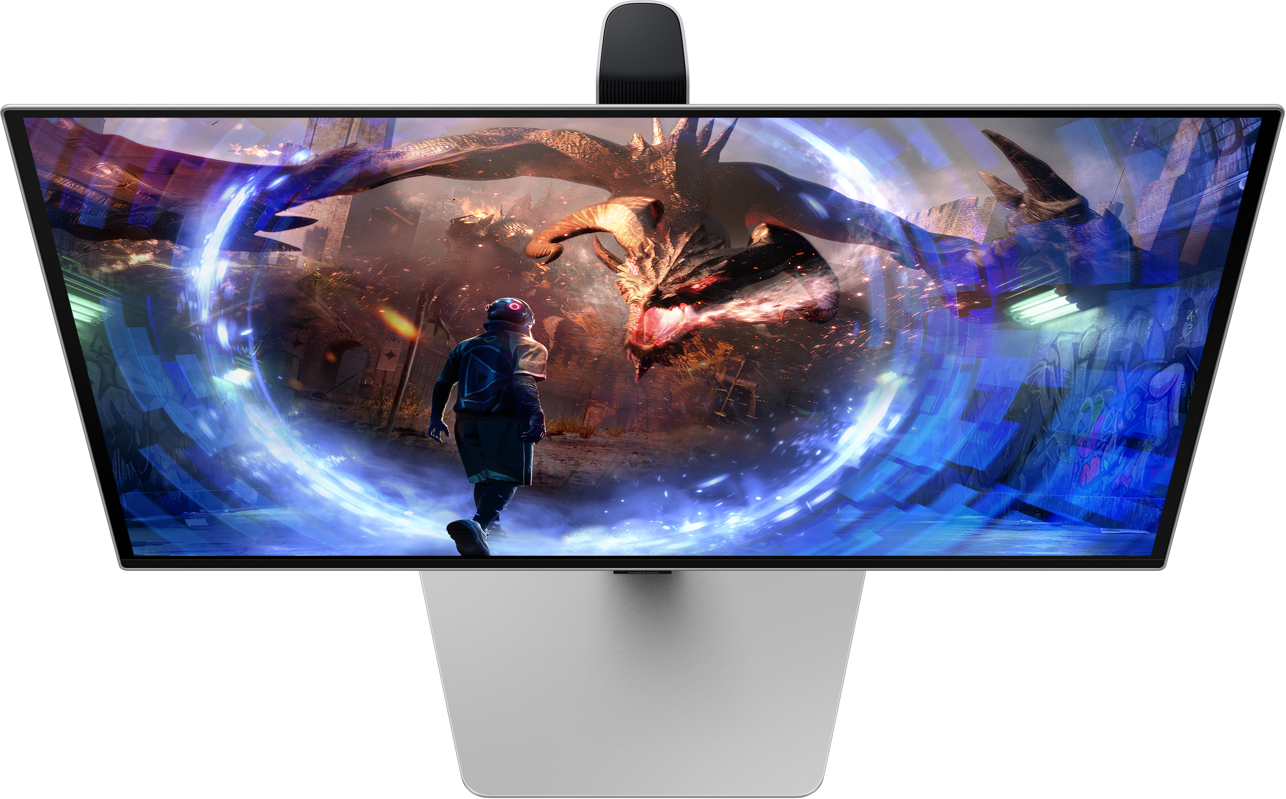 Une personne devant un moniteur affichant un dragon.