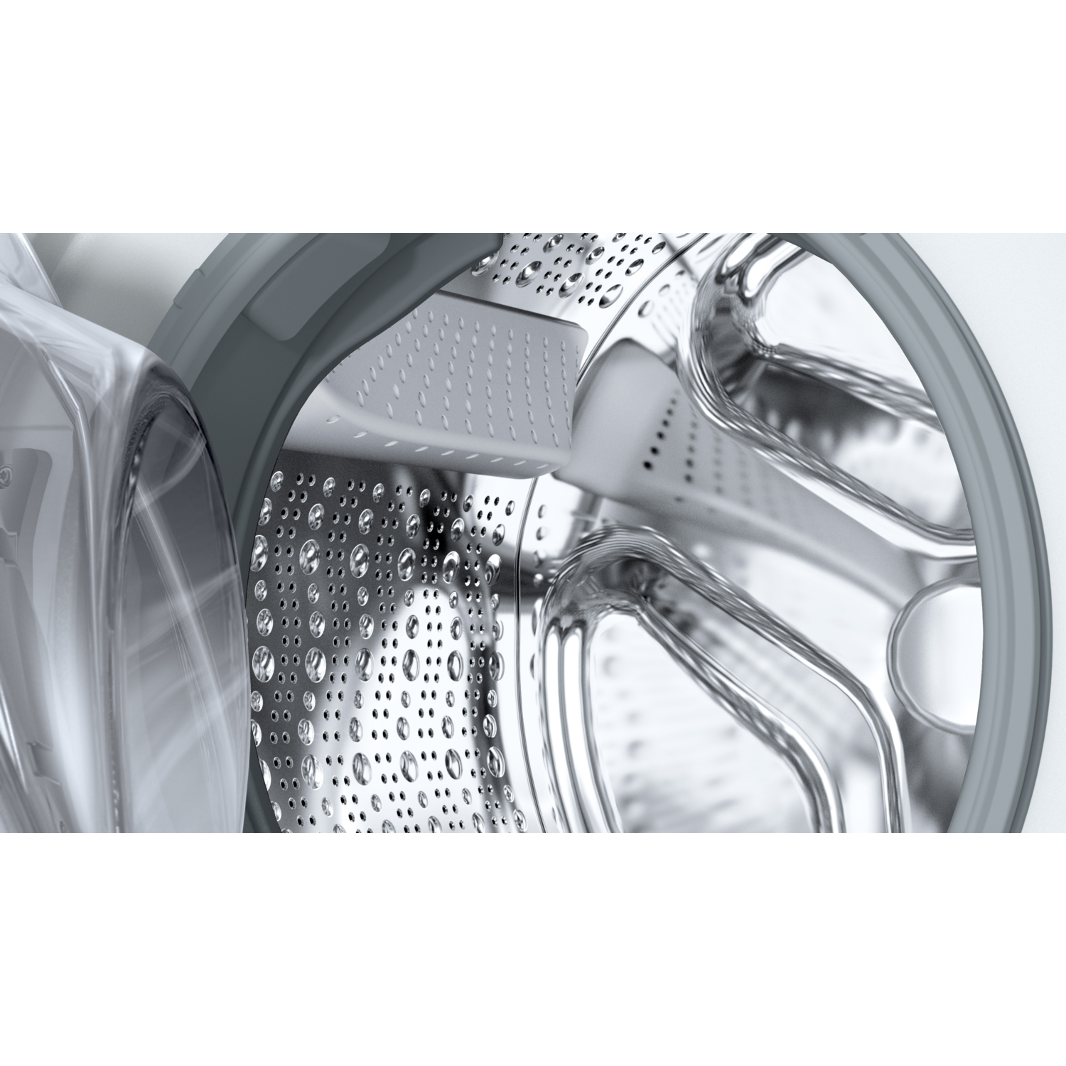 Close-up of a washing machine drum interior, showing the stainless steel surface.