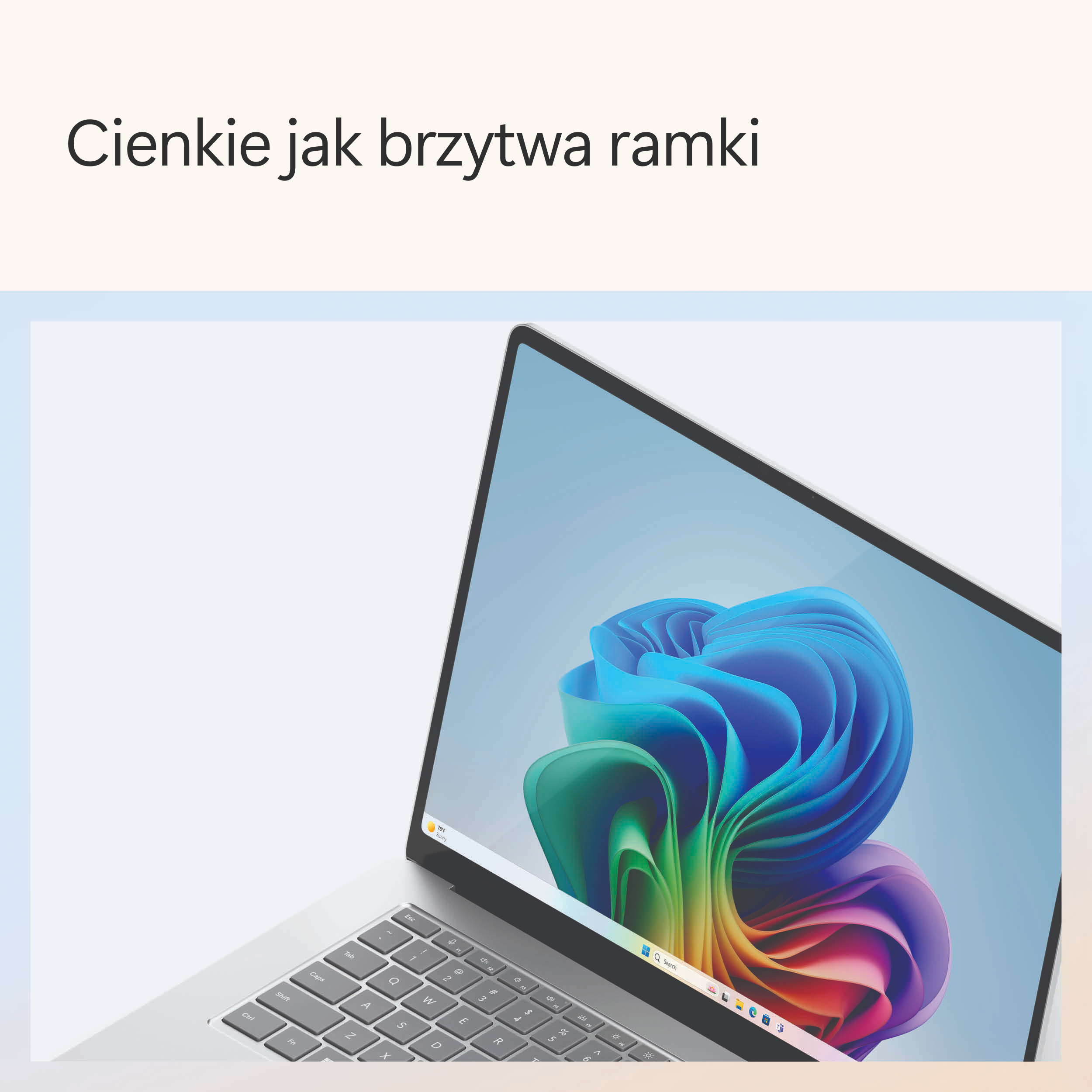 Zbliżenie ekranu laptopa z kolorowym tłem. Klawiatura jest częściowo widoczna.