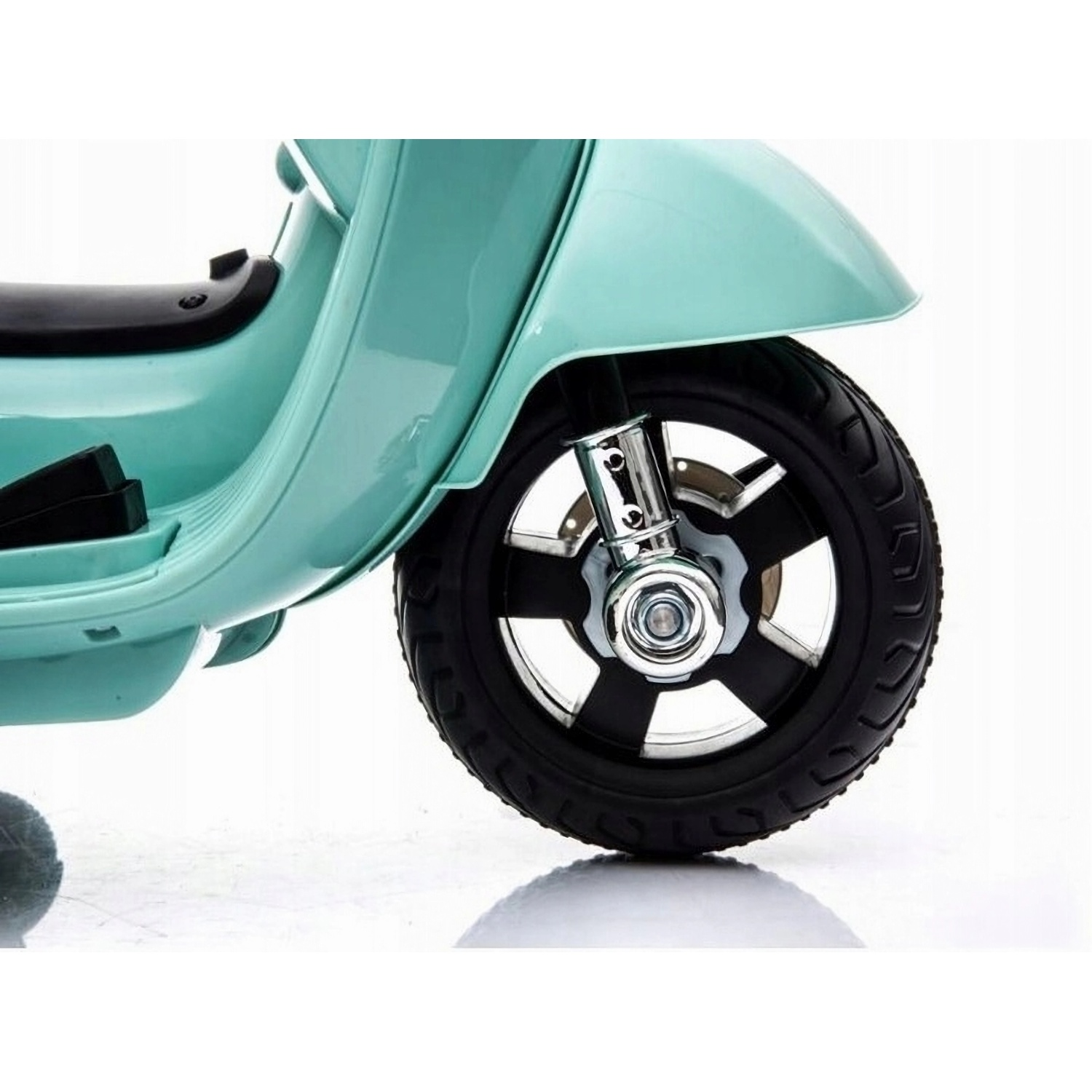 Close-up of a turquoise scooter's front wheel, showing the tire and suspension.
