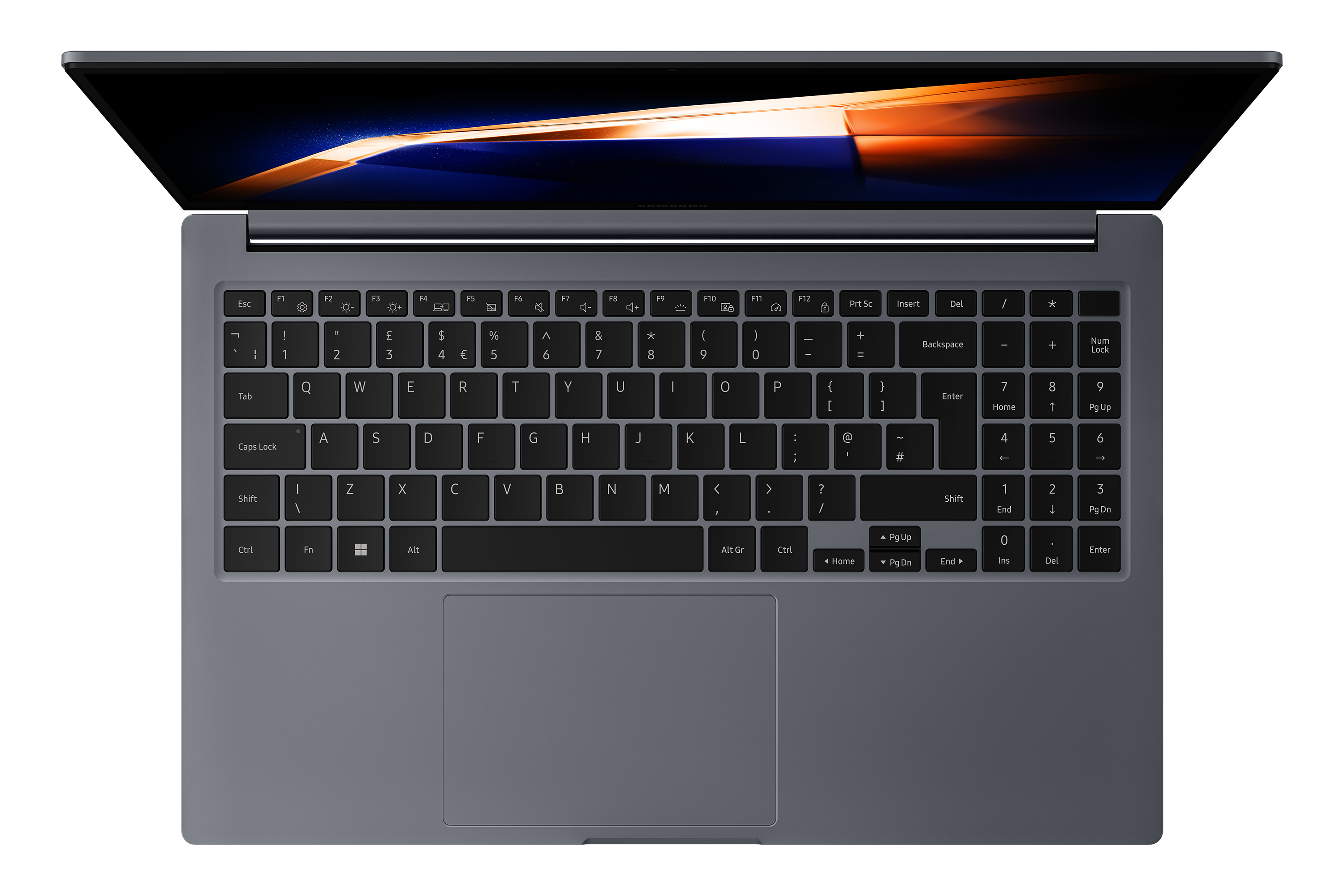 Vista superior de un portátil abierto. El teclado es visible. La pantalla muestra un diseño borroso naranja y azul.