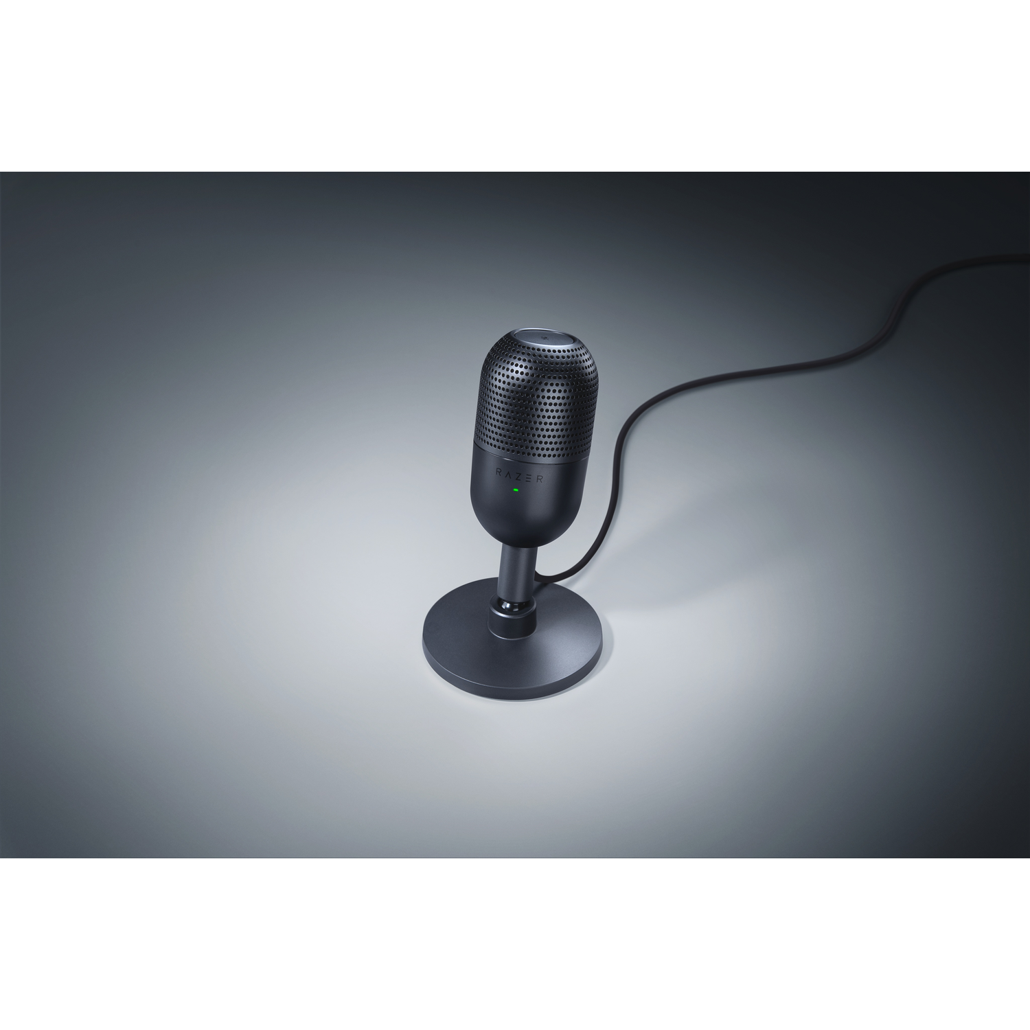 Black Razer microphone with a stand and cable on a grey background.