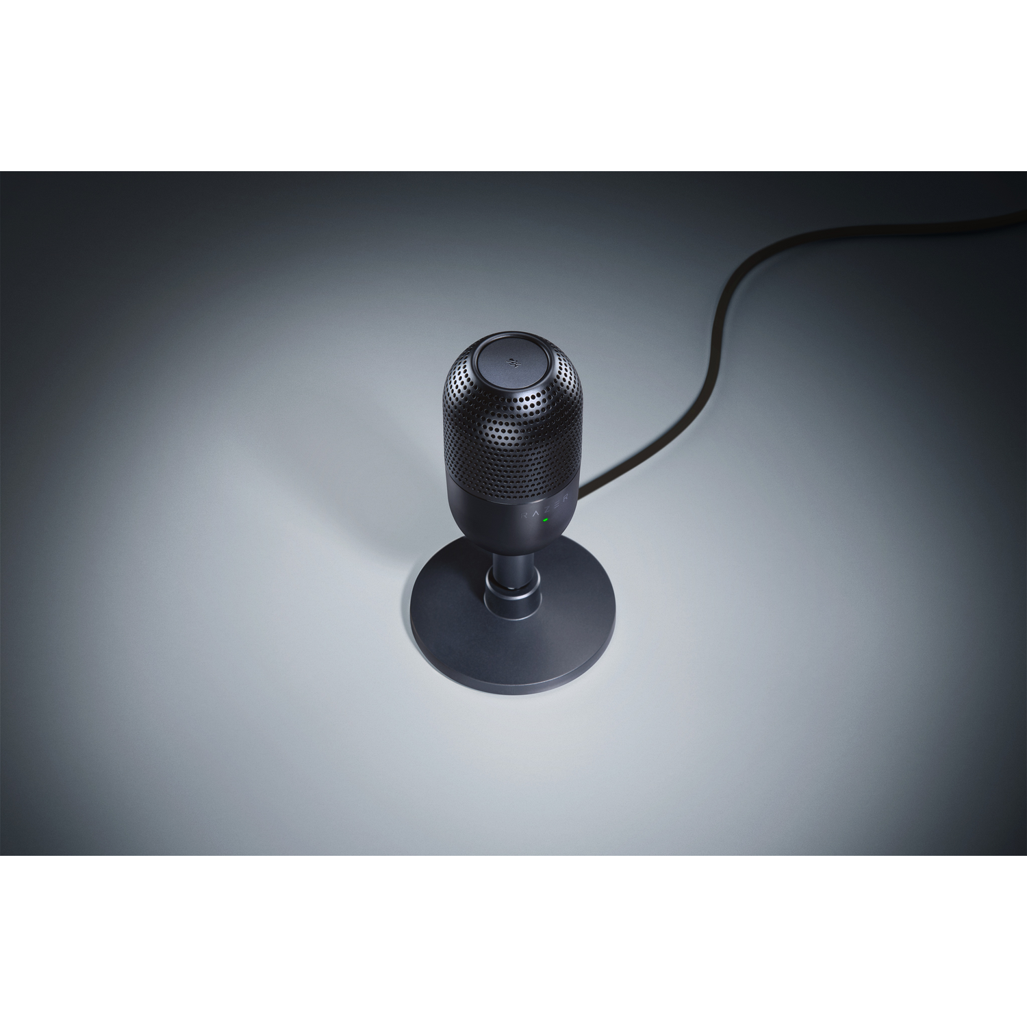 Black microphone on a stand, with a green light on the base.