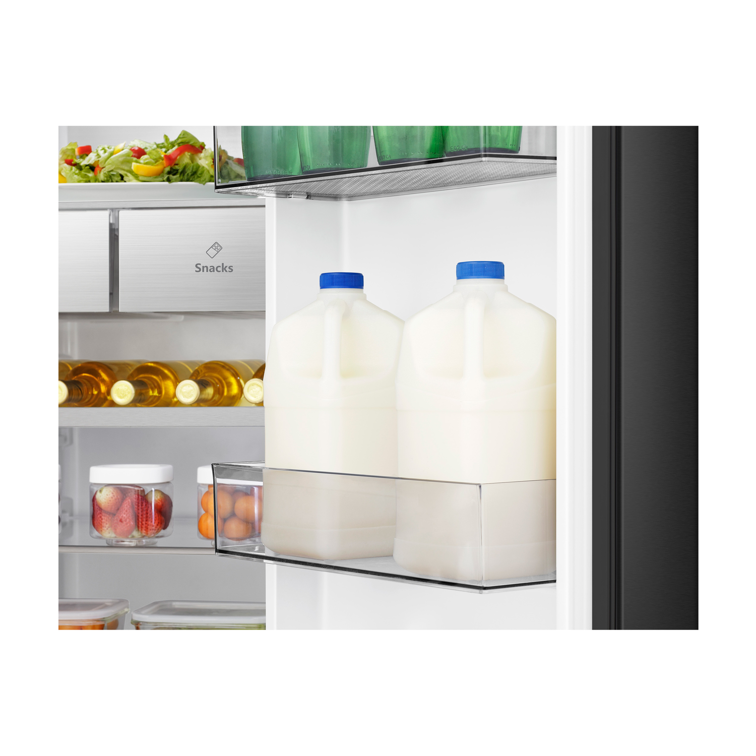 Refrigerator with open door, showing shelves with milk jugs, strawberries, eggs, and salad.