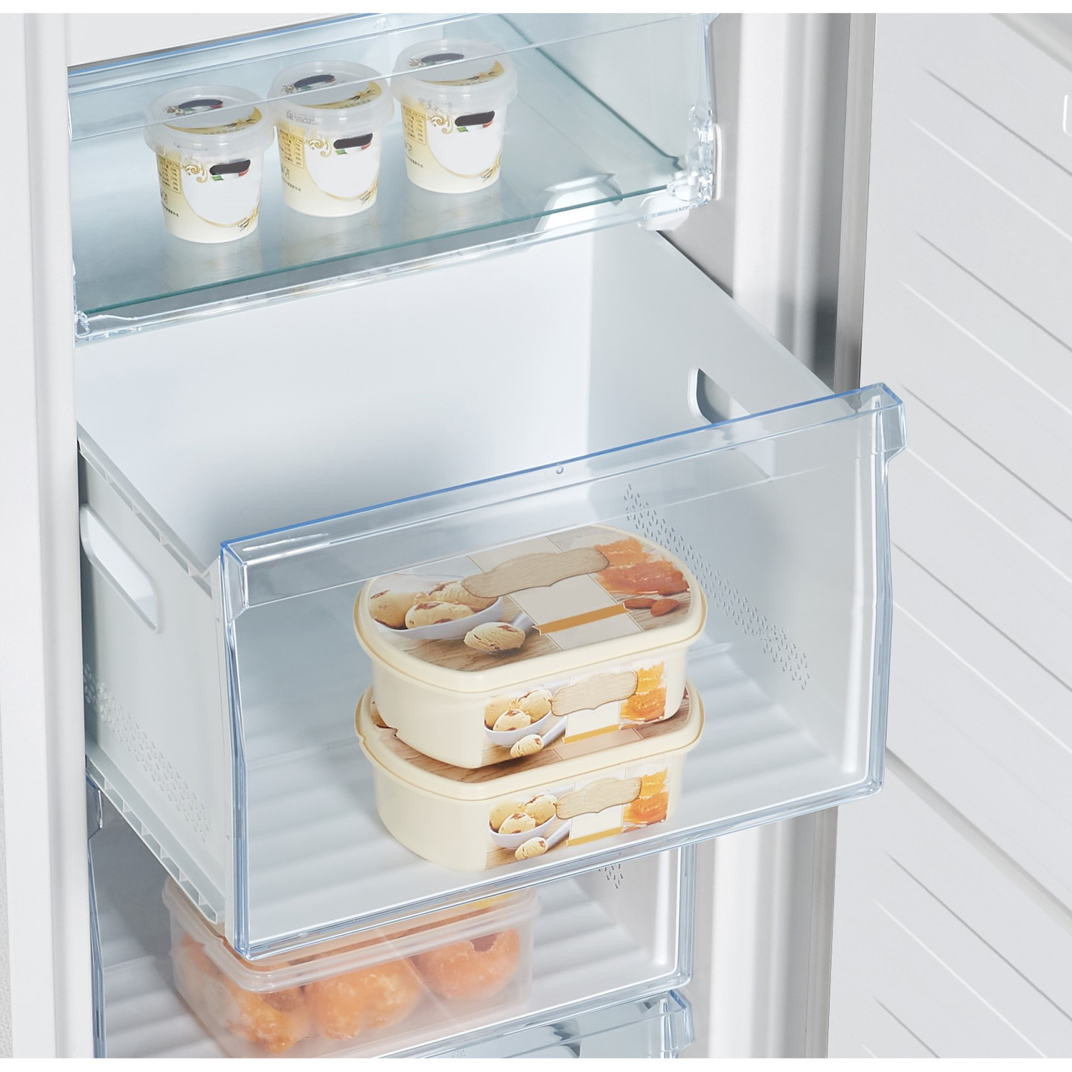 A freezer interior with shelves and drawers. Containers of food are visible inside.