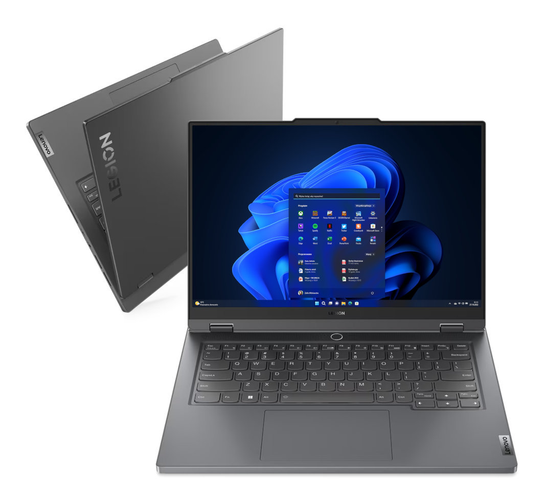 Szary laptop Lenovo Legion jest otwarty, pokazując pulpit Windows. Drugi laptop w tle.