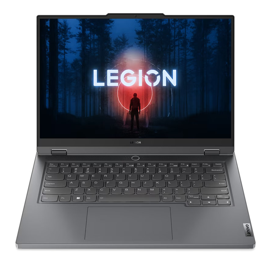 Laptop z ekranem wyświetlającym słowo 'LEGION' w leśnym otoczeniu.