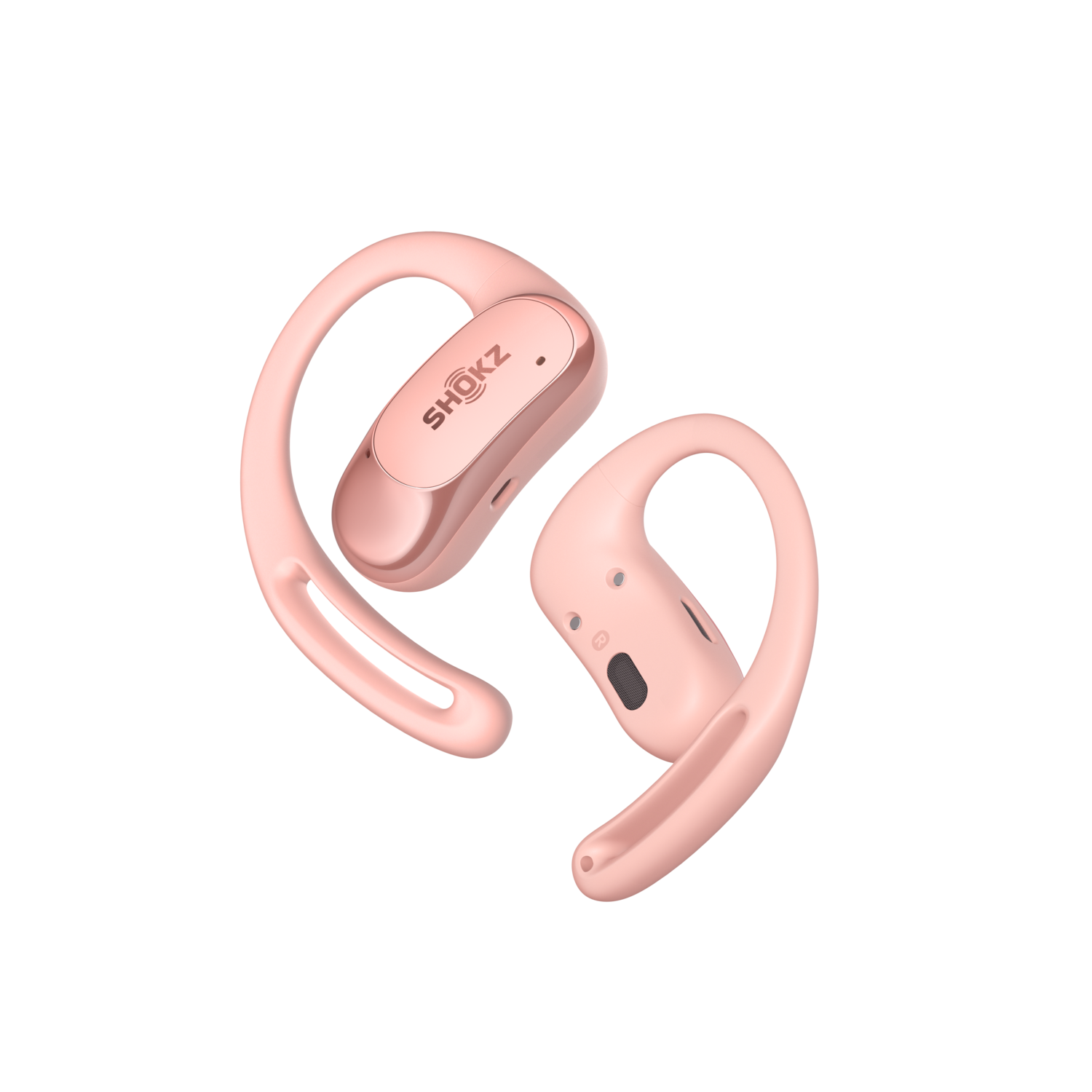 Pink wireless earbuds with ear hooks. Black background.